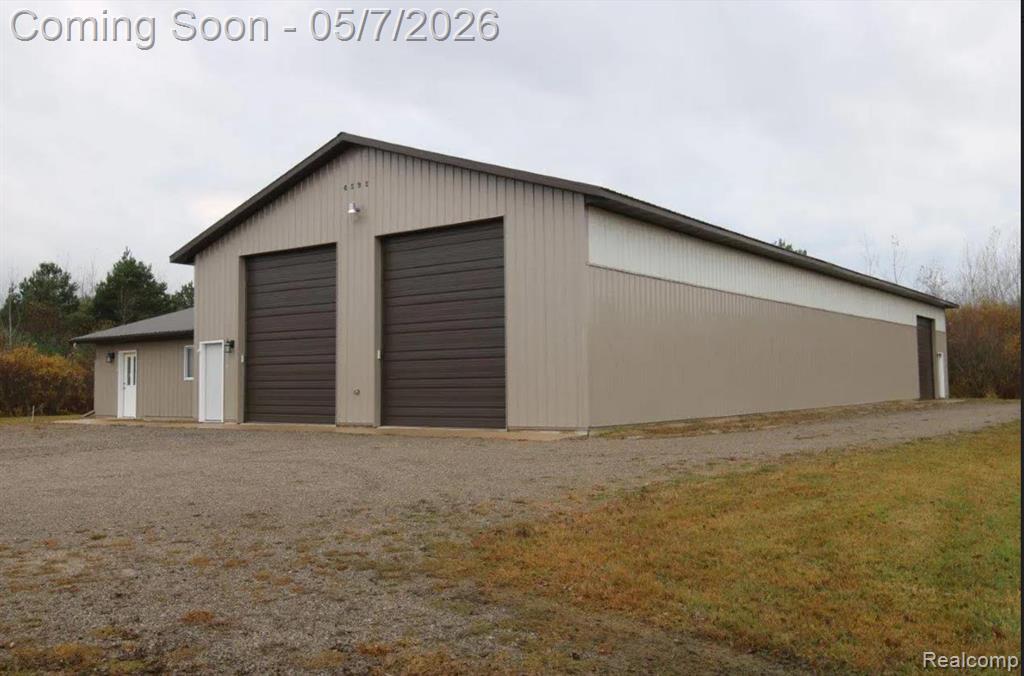 Storage masterpiece this professionally built 40x108 Pole building comes with an additional 24x32 finished living quarters sitting on 9.90 acres close to town. Pole building was constructed in 2014 and consists of 14ft side walls, concrete floor, 2- 12x14 doors with electric garage door openers, 1 12x12 door with an electric garage door opener and 2 entry doors along with 200 amp electric service. The living quarters is finished with a knotty pine interior, a 3/4 bath, kitchen/bar area, storage rooms and a wall furnace. There is also an additional 12x20 garage on the property with cement floor. The 9.90 acres is nicely wooded with trails running through and plenty of wildlife to explore and tons of room for your goodies/toys/storage. If you cannot fill the building yourself, it could be a potential money maker. Don't miss this one.