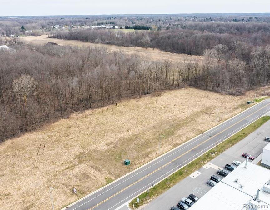 Reduced below market value! Incredible opportunity to own 5.11(+/-) acres of combined acreage across three parcels, zoned Industrial (M-1) with city water and sewer available. This versatile property is ideal for a variety of uses such as light manufacturing, warehouse/distribution, equipment storage, or trade/industrial training facilities. Seller is open to possible land contract terms (sale price to increase with LC). A rare chance to secure prime industrial acreage at an unbeatable price!