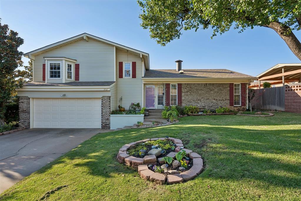 Welcome to this distinctive Edgewater split-level residence offering a blend of comfortable living, flexible spaces, and inviting indoor-outdoor entertaining. This spacious residence offers 2,200 square feet of living space, complemented by an additional 221-square-foot sunroom creating a wonderful extension of the home.The main level of the home features vaulted ceilings and a two-way suspended cone fireplace with sculptural metal hood, and curved brick hearth. The kitchen presents warm natural wood cabinetry, stainless steel appliances, and a striking mosaic tile backsplash, creating a welcoming and functional space for everyday living and entertaining. The split-level layout of the bedrooms and full baths offer flexibility for family, guests, a home office, or other lifestyle needs. Upstairs you will find the primary bedroom with en-suite bathroom, along with two secondary bedrooms and hall bathroom. The lower-level bedroom and full bath are thoughtfully situated near the garage and backyard, creating added privacy and functionality. The sunroom is a standout feature, providing a comfortable space for year-round enjoyment and views toward the beautifully designed backyard. Step outside to discover an outdoor retreat with a terraced yard, swimming pool, fire pit, water feature and covered patio—an ideal setting for relaxing and entertaining. Additional highlights include an underground sprinkler system, and a well-established residential setting with access to green space, trails and Lake Hefner amenities. This home offers a unique opportunity to create a truly enjoyable lifestyle in a sought-after location.