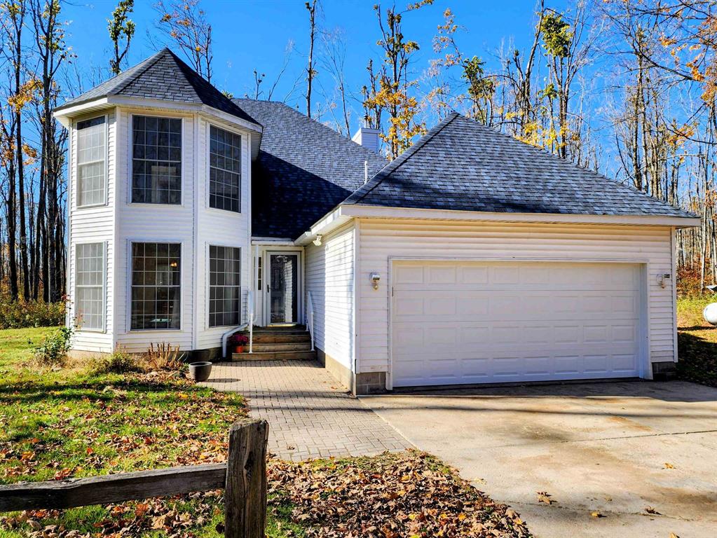 Nestled on nearly 10 acres of beautiful hardwoods, this spacious home offers privacy, potential, and a peaceful country setting in the Gaylord School District. The property features a two-car attached garage with a brand-new insulated door, generous living areas, and endless room to make it your own. A $15,000 flooring allowance provides the opportunity to personalize the interior to your taste. Originally built in the 1990s, the home awaits your updates and ideas to make it your own. Located in the heart of Michigans snowbelt and close to snowmobile trails, this property is perfect for outdoor enthusiasts - bring your toys and enjoy four-season recreation right from your doorstep.