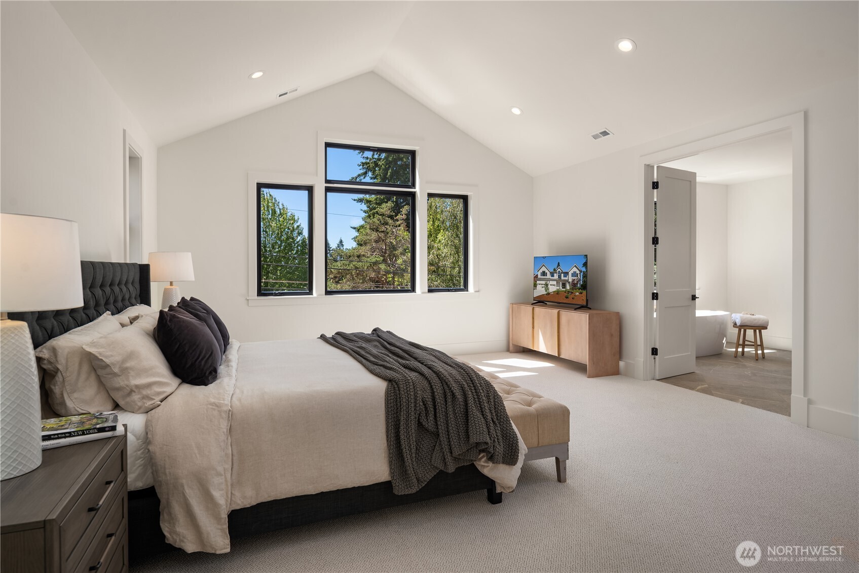 Primary suite features vaulted cielings and a private retreat