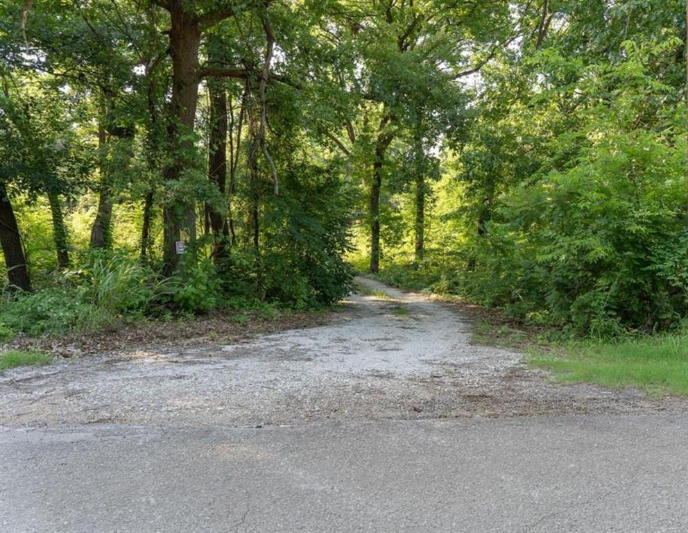 Looking for a beautiful place to get away, this acreage has it! Lush coverage of Huge Oak, Pecan and Sycamore Trees plus an abundance of wildlife including Deer in the area. There is a small shed at the back of the property where the acreage lends itself to all kinds of possibilities including a cabin or homesite. If you're looking for a beautiful small acreage property with tons of large trees and seclusion and all the while close to town, this is it. Come make it your own today.