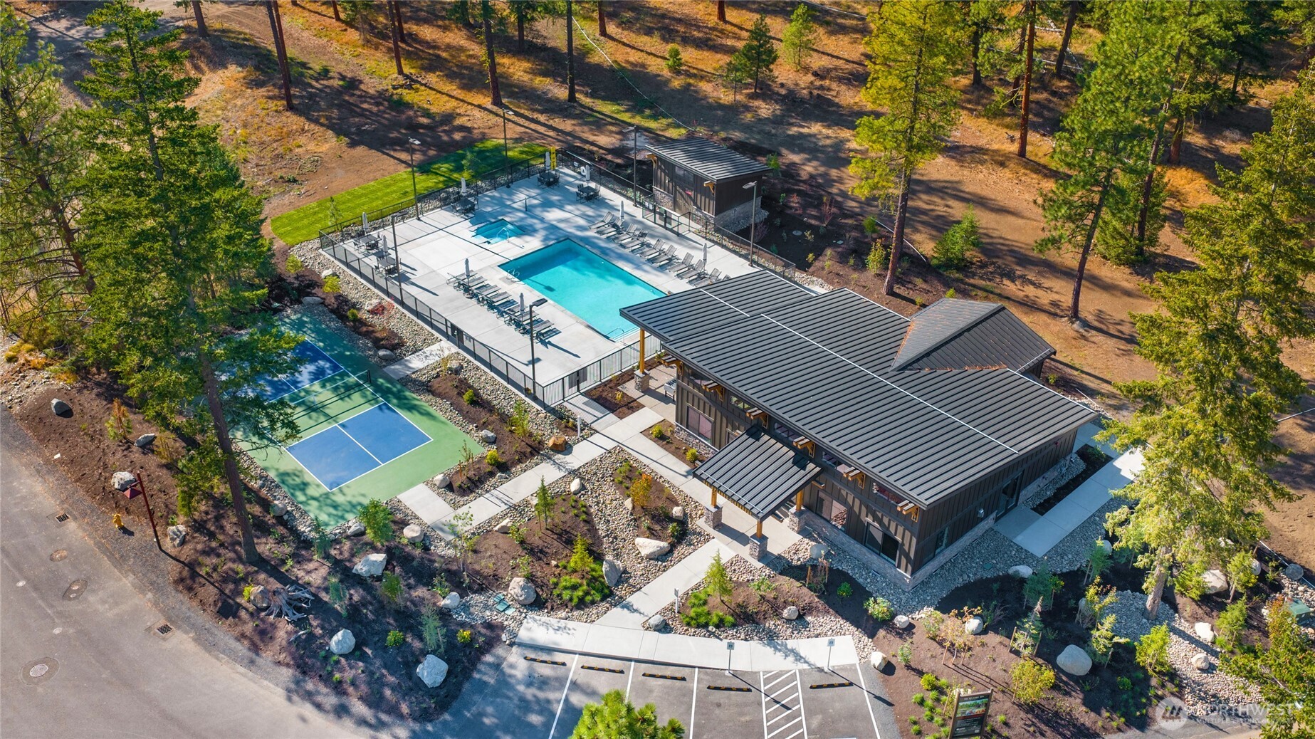 The Uplands Clubhouse with pool, hot tub, and pickleball court.
