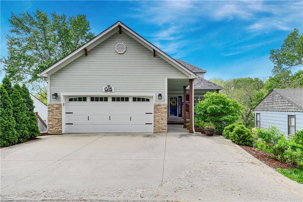 Welcome to 15 G St, your dream lakeside retreat in the coveted Shawnee Cove just inside Gate 2. This stunning waterfront home offers an ideal combination of modern living and natural beauty. Featuring 4 spacious bedrooms and 3.5 updated bathrooms, this home is thoughtfully designed for both relaxation and entertainment. Upon entry, you’re greeted by an open-concept layout with large windows showcasing breathtaking lake views and filling the home with natural light. The updated kitchen is a chef’s dream, boasting quartz countertops, custom-faced appliances, shaker-style cabinetry, and a center island. Adjacent dining and living areas flow seamlessly, offering a cozy atmosphere with built-in dining, lap siding, and a fireplace, perfect for hosting or quiet evenings. Step outside onto the private deck, ideal for grilling and enjoying the outdoors. The master suite serves as a peaceful retreat, complete with a walk-in closet, separate deck entrance, and en-suite bathroom featuring double vanities, a jetted tub, and a standalone shower. Outdoor living is taken to the next level with three levels of decks, perfect for morning coffee, evening cocktails, or soaking in stunning lake sunsets. A short walk leads to the shared double-well dock with a private boat slip and jet ski lift, offering endless opportunities for boating, fishing, or paddleboarding. The fully finished walkout lower level is an entertainer’s dream, featuring a wet bar with appliances (including a kegerator), a walk-in pantry/wine room, and abundant cabinet space. The lower level also includes a spacious entertainment area, a full bathroom, and a guest bedroom. Upstairs, two additional bedrooms, a large living room, a full bathroom, and a martini deck provide even more room to spread out. Perfect as a year-round residence or weekend getaway, 15 G St offers comfort, style, and outdoor living in the vibrant Lake Lotawana community. Schedule your private showing today and start living the dream!