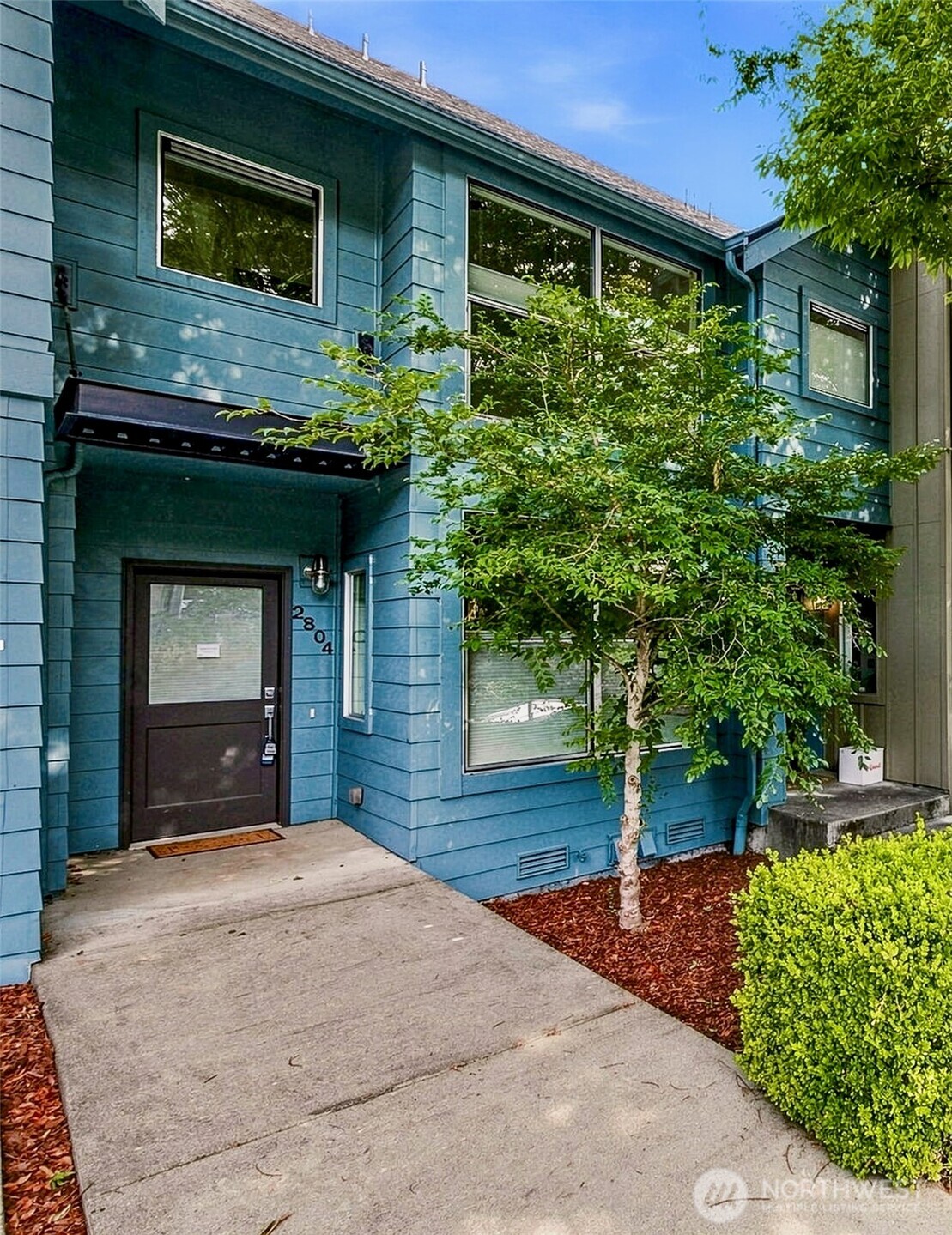 Three bedrooms, a garage, and sunny yard space, right in the heart of Columbia City! With a WalkScore of 78, this modern rowhome is truly in the center of it all. This home sits a step above the competition–sophisticated architectural design with high ceilings, a striking steel and concrete open staircase, intuitive layout, and in completely immaculate condition. Main level living space with large windows, very efficient kitchen design, and a separate dining alcove. Top level provides a spacious primary bed with direct bathroom access and a second bed with floor to ceiling windows. Lower level has a third bedroom and full bath, plus separate entrance via rear door. Rear yard with paver patio, professional hardscape, gardens, and sunshine. This home has been adored and cared for with new carpet and paint, updated bath, new Milgard windows, and ongoing preventative maintenance, truly move-in ready. Upgraded blinds on all windows, roof new in 2025. Detached garage with easy drive-in access and room for bikes and gear. With such close proximity to the urban core of Columbia City, you can walk to Farmer’s Market for produce or home from a night out. Light rail right at your doorstep for stress-free connection to all of the best things about Seattle.