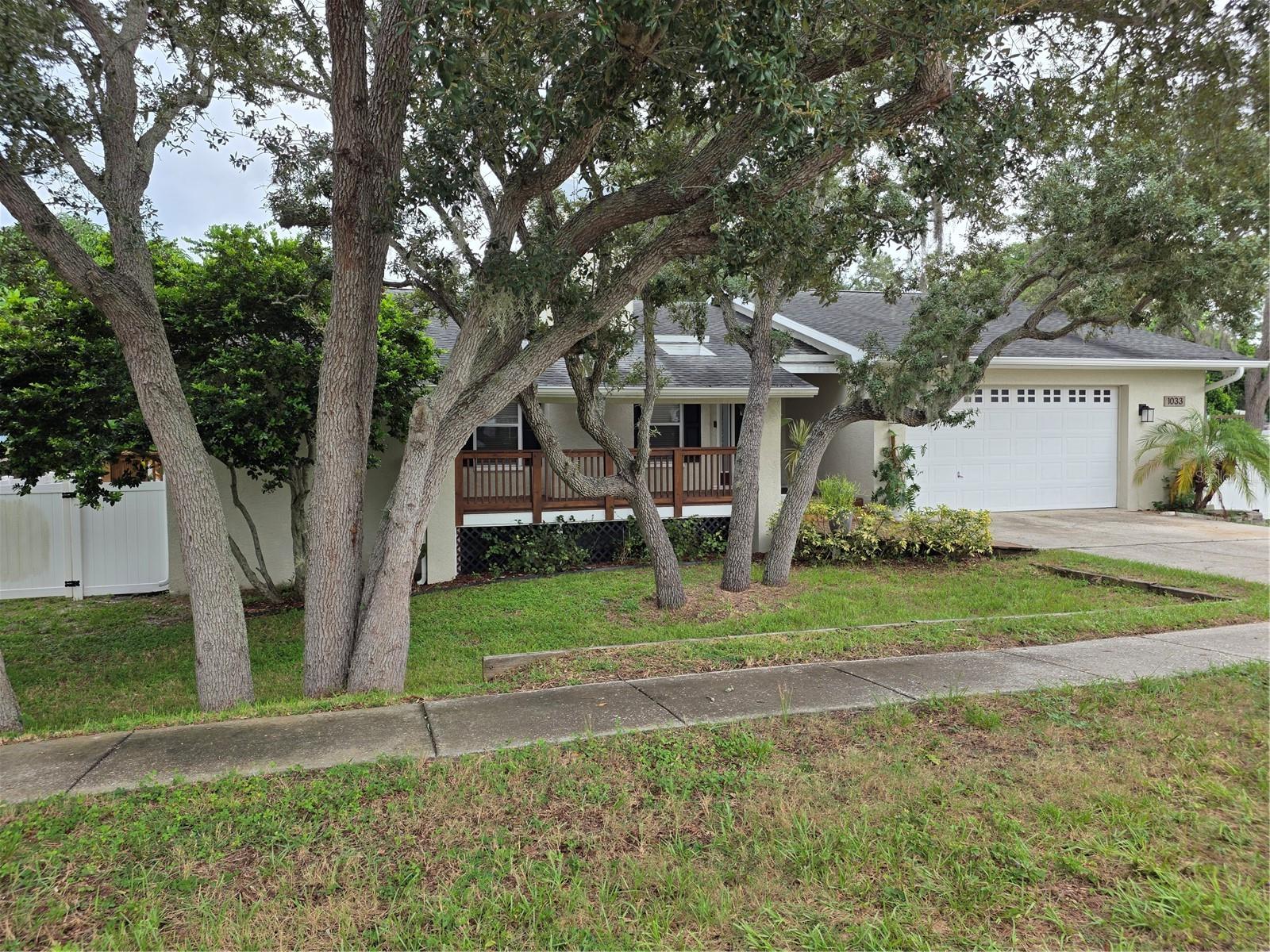 **3-bedroom, 2-bath home in desirable Tarpon Springs.** Inside, you’ll find a bright, open layout filled with natural light and designed for comfortable everyday living and entertaining. The kitchen features modern appliances, generous cabinetry and ample counter space, flowing easily into the dining and living areas. The spacious primary suite offers a walk-in closet and private en-suite bath, while two additional bedrooms provide flexibility for guests, a home office or hobby space. Step outside to enjoy the **fully fenced over sized lot**, offering plenty of room to relax, entertain and enjoy Florida living year-round. A dedicated **greenhouse** is an added bonus for gardening enthusiasts. Located in the heart of Tarpon Springs, this home offers convenient access to area beaches, parks, tennis courts, recreation, shopping, dining and vibrant downtown Tarpon Springs. Enjoy popular local events such as First Fridays, or spend the afternoon exploring the famous **Tarpon Springs Sponge Docks**, known for their Greek heritage, waterfront restaurants, shops and entertainment. An important feature of this property is its drainage. **According to the seller, the home has not experienced flooding during previous major storms, and the property’s original drainage design has performed exceptionally well.** Whether you’re looking for a full-time residence or your own Florida retreat, **this home offers, privacy, location and lifestyle that make Tarpon Springs such a desirable place to call home.** **Priced below market value and recent comparable sales, this home presents an excellent opportunity for buyers looking to add their own personal touches and build equity. The property will likely need a new roof in the near future, along with some cosmetic TLC, and the asking price has been adjusted accordingly. The seller's say there have been no known roof leaks during their ownership. ** Schedule your private showing today and come see everything this home has to offer. All information deemed reliable from sellers. Room Measurements are approx. buyer to verify. As-Is contract with POF or PRE-QUALIFICATION with all offers
