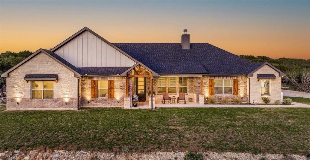 Discover the perfect combination of comfort, style, and acreage with this 4-bedroom, 2.5-bath home set on 5.031 scenic acres in the desirable Mountain Lakes community. Inside, an open floor plan creates an inviting flow between the living, dining, and kitchen areas—ideal for gatherings. The large bonus room offers flexibility for an entertainment space, home office, or hobby room. The kitchen is a true centerpiece, featuring an oversized barstool seating island, farmhouse sink, granite countertops, and a walk-in pantry. A mudroom conveniently connects the utility room to the master bath, adding everyday functionality. Outside, enjoy peace and privacy surrounded by wildlife, with plenty of room for gardening, recreation, or simply relaxing under the wide Texas skies. The Mountain Lakes community offers two beautiful lakes, a sparkling pool, and scenic common areas—perfect for outdoor living. All this, just 15 minutes from both Granbury and Stephenville, gives you the best of country living with city convenience.