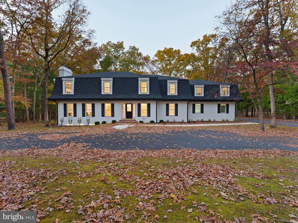 Welcome to this show-stopping, fully renovated 4-bedroom, 4.5-bath home in the highly sought-after Centennial Lake neighborhood. Everything is new—no detail has been overlooked from top to bottom! Step inside to find a culinary dream kitchen designed for the home chef, featuring a professional appliance package with a wall oven and microwave combo, plus an impressive 48-inch gas range with dual ovens below. The first floor also offers spacious living and family rooms, a formal dining room, a mudroom, a full bathroom with pool access, a separate half bath, and a versatile bonus room with rough-in plumbing—perfect for a pub, home office, or creative space. The dramatic two-story foyer with a white oak open staircase leads to four bedrooms and three full bathrooms upstairs. The luxurious primary suite includes two large walk-in closets, a linen closet, and a spa-inspired bath with a custom-tiled shower and freestanding soaking tub. The upper level also features a convenient laundry room and a generous step-down bonus room ideal for a playroom, game room, or home theater. Outside, enjoy your private oasis with a large, partially wooded yard and a beautiful in-ground pool complete with a slide, diving board, new pool filter, and custom cover. The full basement offers additional living potential, partially finished for flexibility. Recent upgrades include a new exterior, roof, hot water heater, HVAC systems, electrical upgrades with a new panel, well water system, windows, and a newly paved driveway. This home is truly turn-key and ready for its new owner. Don’t miss your chance to experience luxury living in Centennial Lake—schedule your private tour today!