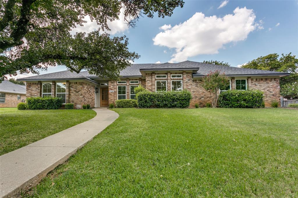 Welcome to this beautifully updated single-story brick home in the heart of Colleyville! Nestled on a spacious lot with mature trees and a charming front elevation, this residence blends timeless curb appeal with modern updates.

Inside, you’ll find a light-filled open floor plan featuring fresh paint, new flooring, and designer lighting throughout. The living and dining areas offer generous space for both everyday living and entertaining, complemented by elegant wall trim details and a dramatic tray ceiling.

The fully renovated kitchen is a standout, boasting quartz countertops, sleek tile backsplash, stainless steel appliances, and custom wood cabinetry with ample storage. It seamlessly connects to the dining and living areas, making it the true heart of the home.

The private primary suite is a relaxing retreat with a spacious layout, dual vanities, a large walk-in closet, and a spa-inspired bathroom featuring designer tile and modern finishes. Additional bedrooms are equally inviting with oversized windows and updated fixtures. The secondary bath is tastefully remodeled with designer tile, a wood vanity, and brushed gold accents.

Step outside to enjoy the large backyard with covered patio and plenty of space for outdoor living, gardening, or future customization.

Located in a highly desirable Grapevine-Colleyville ISD, this home combines stylish upgrades with the warmth of a traditional layout—perfect for today’s lifestyle.