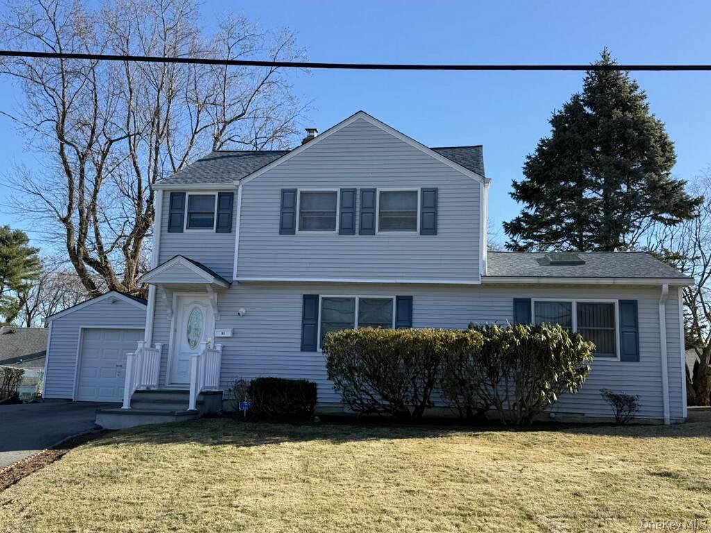 Discover this well-maintained Colonial home nestled in the heart of the sought-after Sprain Lake Knolls neighborhood. The second level offers three bedrooms and a full bathroom, while the first floor includes a versatile bonus room that can serve as a family room or a primary suite with its own full bath. The open living and dining area creates a warm, inviting atmosphere.The kitchen features granite countertops and provides easy access to the spacious backyard through a convenient side door. The finished basement offers a great option for a home office or play area, and the full attic provides ample storage space. Outdoors, the backyard patio is the perfect spot to enjoy your morning coffee and is ideal for entertaining.Additional highlights include a one-car garage and two extra parking spaces in the driveway. This home is also conveniently located near major highways and abundant shopping.