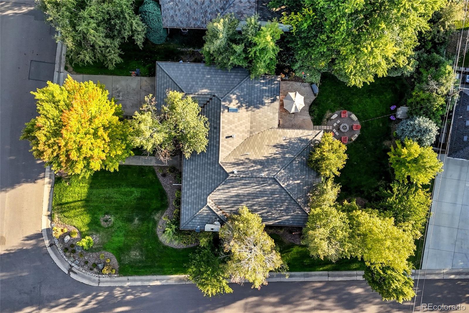 Nestled on a beautiful, tree-lined 12,000 sq ft corner lot in Crestmoor Park, this charming 4-bedroom, 3-bath brick ranch has been completely updated & is truly move-in ready. Fresh neutral paint & beautiful newly refinished hardwood floors throughout, reflecting the pride of ownership shown by the original family, who lovingly cared for the property for more than 72 yrs. Step inside to a warm and inviting living room featuring a cozy gas fireplace and sun-filled corner windows. The updated kitchen offers timeless cabinetry & newer appliances and opens to a lovely breakfast nook and elegant dining room, perfect for everyday living or hosting family and friends. A spacious family room with original brick details overlooks the private outdoor retreat, complete with a gas firepit & expansive covered patio, ideal for year-round entertaining. 3 main-level bedrooms provide flexibility for family, guests, or a home office. The primary suite is a true retreat w/ a beautifully renovated bathroom featuring a walk-in shower and an expansive custom walk-in closet. The finished basement adds valuable living space with brand-new carpet, a non-conforming bedroom w/ a spacious closet and built-in Murphy bed, and a stunning full bathroom with a walk-in steam shower. An unfinished area offers abundant, easily accessible storage. Enjoy peace of mind with a high-end, concrete tile roof, new radon mitigation system, and a home that has been thoroughly checked from top to bottom. Outside, enjoy beautiful landscaping & quiet, tree-lined streets of Crestmoor. Homeowners benefit from coveted, expedited access to the Crestmoor Swim & Tennis Club -one of the community’s most desirable amenities. Highly walkable & ideally located near parks, top-rated schools, and shopping and dining in Cherry Creek, Boulevard One, & Lowry. This single-story home offers exceptional livability today w/ outstanding expansion potential for the future, all in one of Denver’s most sought-after neighborhoods.