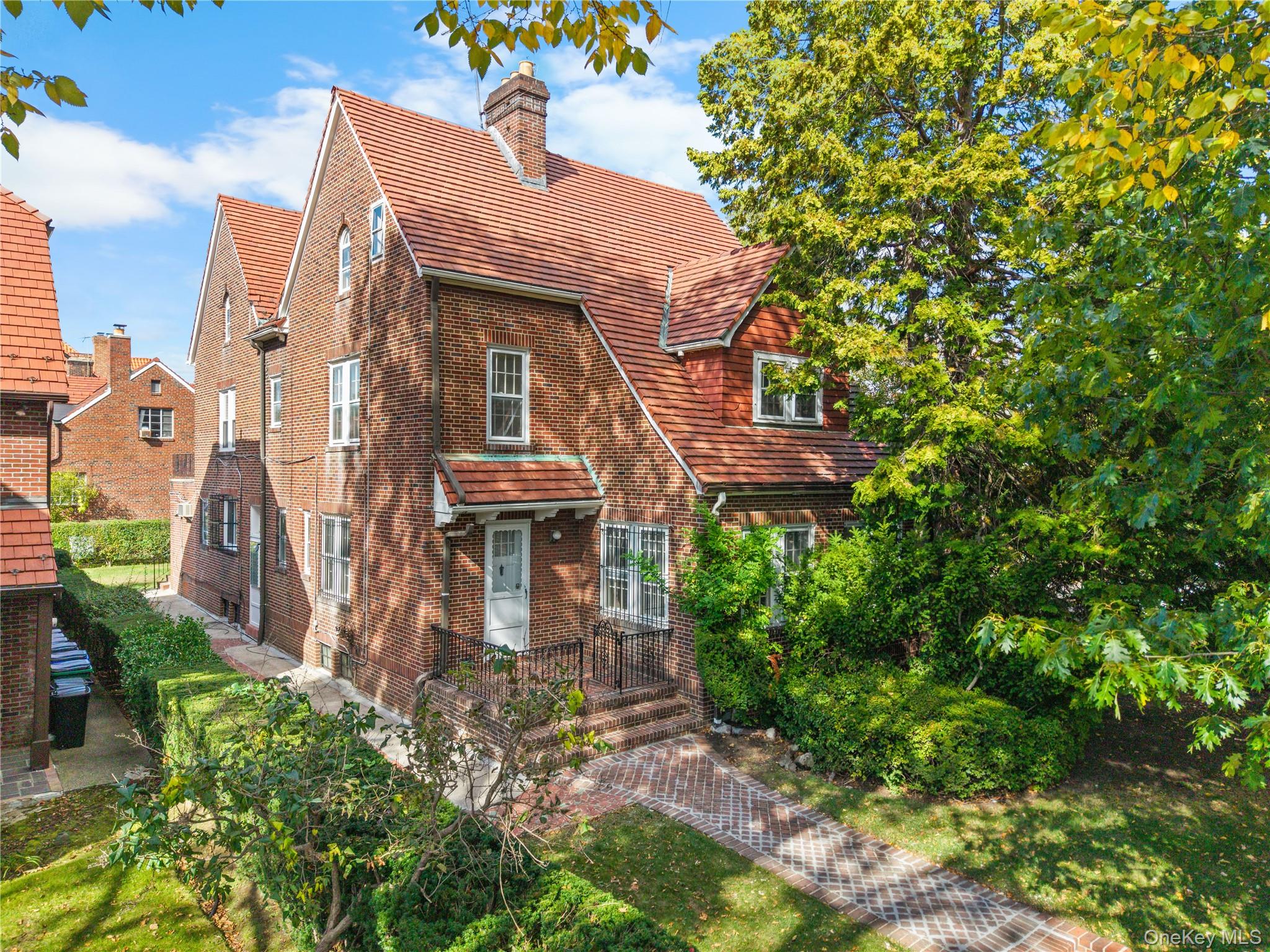 Stately Tudor-style residence located in the highly desirable Forest Hills Gardens. Situated on an approximately 8,000 sq ft lot, this property offers 4,735 sq ft of interior living space with classic architectural details throughout.The first floor features an expansive living room with fireplace, den with an additional fireplace and side entrance, formal dining room, eat-in kitchen with seating area, powder room, and an attached garage with interior access.The second floor includes four bedrooms and two full bathrooms, including a primary suite with ensuite bath and dressing room. One bedroom offers access to a private balcony.The third floor provides an additional bedroom, full bathroom, walk-in closet, and flexible bonus space suitable for a home office, gym, or playroom, along with additional storage.The finished basement includes a full bathroom, recreation area, laundry and utility rooms, and a separate side entrance.Property requires renovation and is being sold as-is, presenting an opportunity for customization.Zoned R3-1; potential for conversion to a legal two-family (buyer to verify with architect and local authorities).Conveniently located near transportation, including the Long Island Rail Road Forest Hills Station and subway lines (E, F, M, R), as well as schools, shopping, and dining—all within approximately 5–10 minutes walking distance.A rare opportunity to create your dream home.