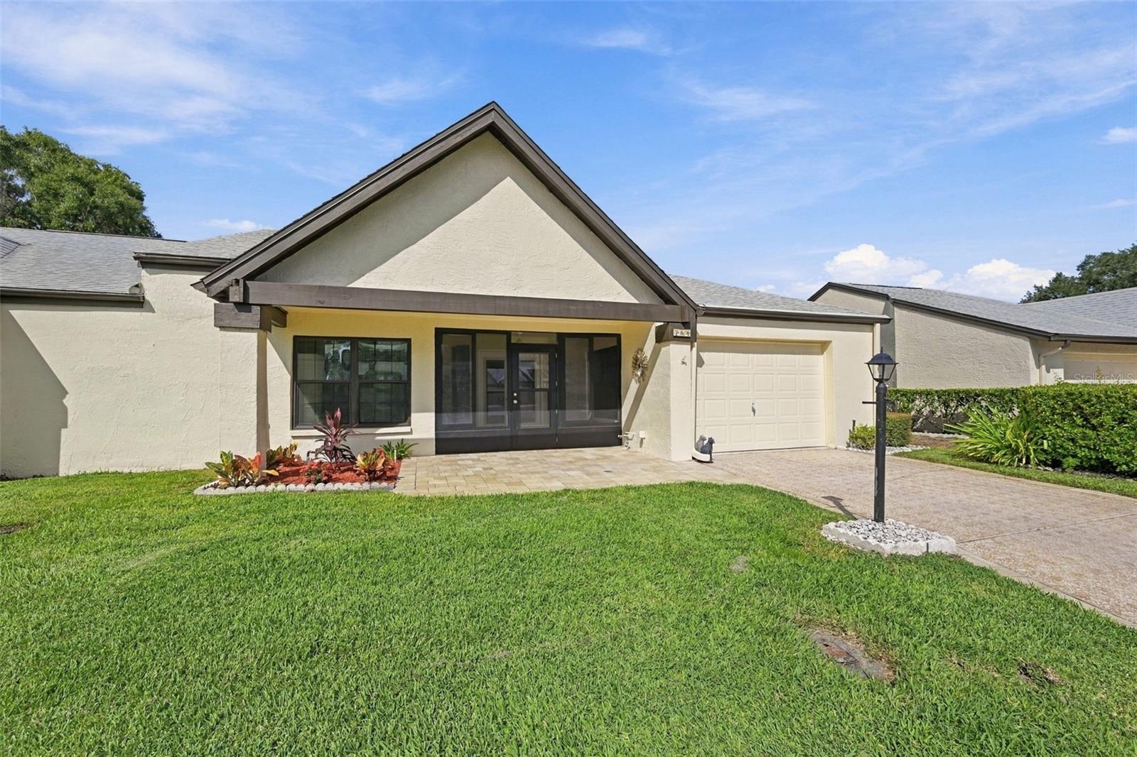 Rosewood model villa overlooking tranquil and serene pond in back. This model home features split bedrooms, open flow, bonus room or office or den flex area. No rear neighbors. Home features include formal dining room, formal living room, eat in kitchen with granite countertops, a screened in front porch, and an attached garage. Recent upgrades include 2021 roof, windows, hot water tank, newer flooring throughout, and newer interior paint. Sutton place maintenance fee includes sprinklers for lawn, lawn spraying, trash pick up twice weekly, basic cable, and painting of exterior. Highland Lakes has a main clubhouse with heated pool & spa, activities, free community boat, RV storage, (3) 9 hole golf course, all included in low monthly fee.
