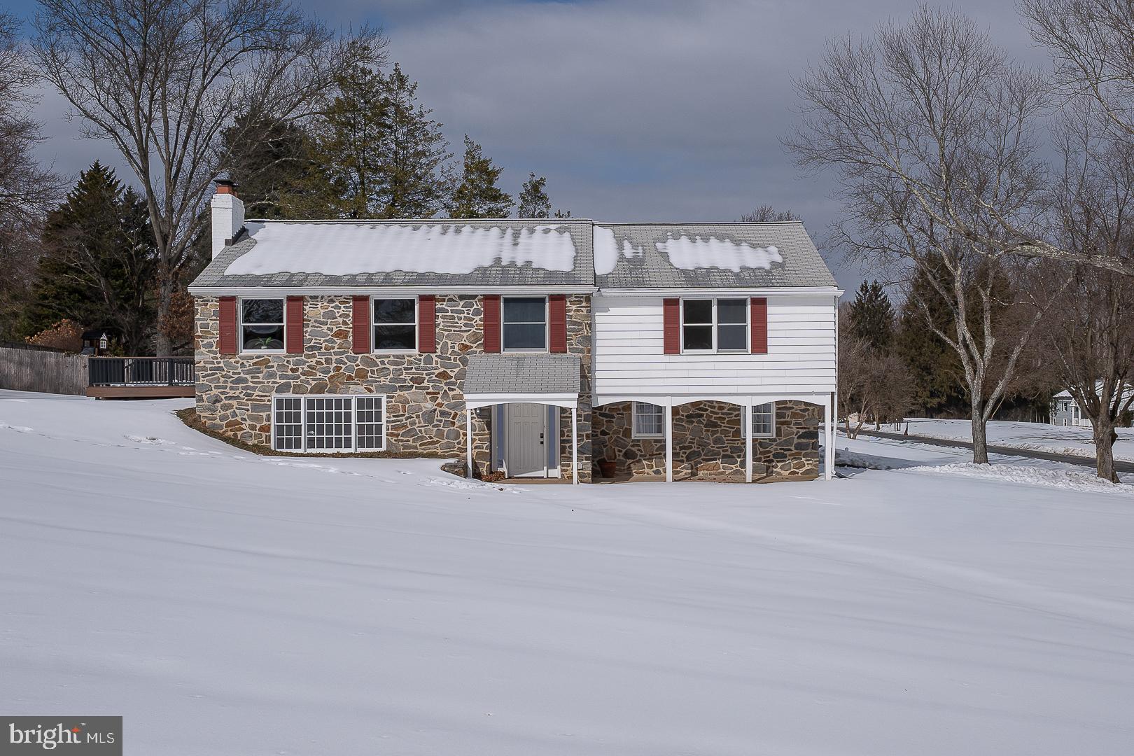 Welcome to 1105 Waterloo Rd, a 3 bedroom, 2 1/2 bath home, set on a full acre in the heart of Easttown Township.  Enter through the foyer, to the left is a large, bright family room  with lots of windows and a stone fireplace.  There is a lovely updated powder room and a storage room with the washer, dryer, built -in storage closets and the entrance to the 2-car garage.  Head up the stairs to the main living area - there is a living room with fireplace and a dining room - perfect for those holiday gatherings. Hardwood floors, crown molding, chair rail detailing and abundant natural  light throughout the home combine for classic elegance with modern updates. The beautifully renovated kitchen is the heart of the home with quartz countertops, a large center island, tile backsplash and newer stainless steel appliances. There is even a dedicated coffee bar making this space equally suited for daily use and casual hosting.  The kitchen flows directly into an enclosed porch, which leads to a newer maintenance -free  deck overlooking the side yard, an ideal setting for outdoor dining, quiet mornings or weekend gatherings. Also on this level are the bedrooms. The Primary bedroom offers privacy and comfort, complete with a walk-in closet and an updated ensuite bathroom.  There are two additional bedrooms and a hall bath on this level - providing flexibility for guests, home office or family living. This home is in the award winning T/E School District - convenient to all major highways and everything the Main Line has to offer- this is a perfect home for today's lifestyle.