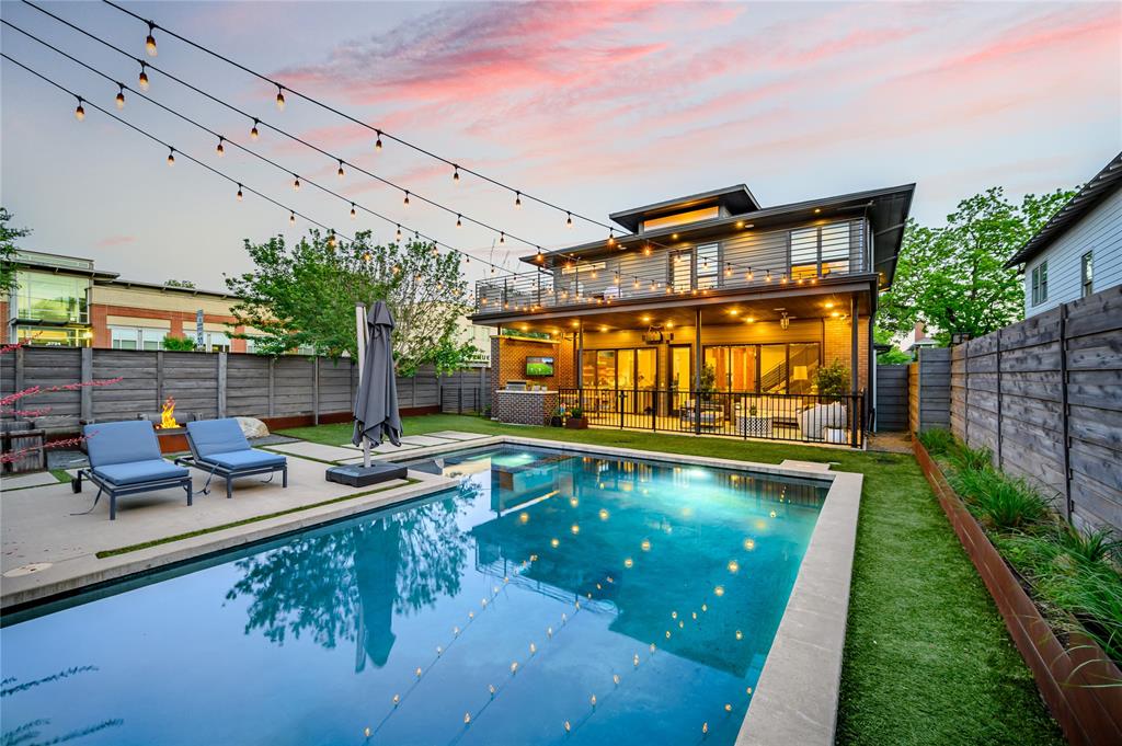 NEW PRICE. EXCEPTIONAL AMENITIES. LOWER GREENVILLE LOCATION. Strategically priced to command attention, this home pairs modern sophistication with Craftsman character. Built in 2014 within the Vickery Place Conservation District, it offers a distinctive combination of architectural presence, modern construction, a separate guesthouse, and a poolside retreat. Beyond the welcoming front porch, substantial wood beams, polished concrete floors, a floating staircase, and expansive windows define the open living spaces. Gather around the living room fireplace or host dinner beneath sculptural lighting. The kitchen features an oversized island, gas cooktop, built-in refrigerator, brick accent wall, and floating wood shelves. An adjacent serving bar with beverage storage keeps entertaining easy.A downstairs bedroom and full bath offer flexibility for guests or a home office. Upstairs, the primary suite features hardwood floors, a generous private balcony, soaking tub, separate shower, dual vanities, and a walk-in closet. Two additional bedrooms with fresh carpet share a Hollywood bath with separate vanities.Outside, covered living and dining areas overlook the gunite pool and spa. A built-in BBQ, gas firepit, artificial turf, separate dog run, and convenient pool bath create a backyard made for everyday enjoyment and memorable gatherings.Above the two-car garage, the separate studio guesthouse includes its own kitchen, full bath, closets, and laundry—ideal for extended stays, work, a gym, additional rental income or a personal retreat. An electric gate and EV charging add convenience.Walk to Terilli's, SISTER, Goodwin's, Halcyon, and Cafe Duro, with more Lower Greenville favorites nearby such as Trader Joe's and Quarter Acre. Sophisticated design, exceptional outdoor living, and a walkable Dallas lifestyle—all at a compelling new price.Guesthouse and pool bath NOT included in size-square ft.Offer deadline: Monday, November 9th at 7:00pm.