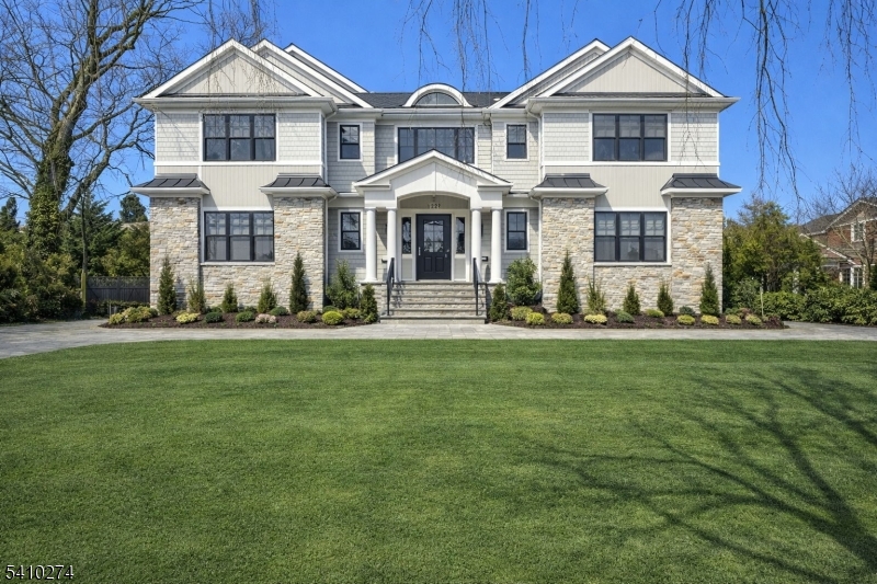 There are homes that impress and then there are homes that define a lifestyle. Newly constructed in 2024, 127 Stewart Road is a 7,500 sq ft estate, masterfully designed for elevated living and grand-scale entertaining. A striking exterior of HardiePlank siding, Azek trim, stone water table, and standing-seam metal accents creates timeless architectural presence. A wide driveway leads to a finished 3-car garage with epoxy floors, EV charging and smart access. Inside, 10' ceilings, wide-plank white oak floors and 8' solid-core doors establish refined sophistication. Designer lighting, a first-floor library with custom built-ins, and a private ensuite guest suite add both elegance and flexibility. The chef's kitchen is a showpiece with custom Shiloh cabinetry, quartz surfaces, an oversized island, 48  Wolf smart range, Sub-Zero refrigeration, Bosch dishwasher, walk-in pantry and fully equipped butler's pantry crafted for seamless entertaining. Upstairs, the 900 sq ft primary suite offers a fireplace, dual California Closets and a spa-inspired bath with soaking tub, oversized shower with body jets and curated finishes. The finished lower level elevates lifestyle with a custom bar, wine cellar, gym, sauna, steam shower and 72  chromatherapy Jacuzzi. Sonos audio, multi-zone HVAC, whole-house filtration and a raised paver patio overlooking a fully fenced, private backyard complete this exceptional offering. 127 Stewart Road is modern luxury executed without compromise.