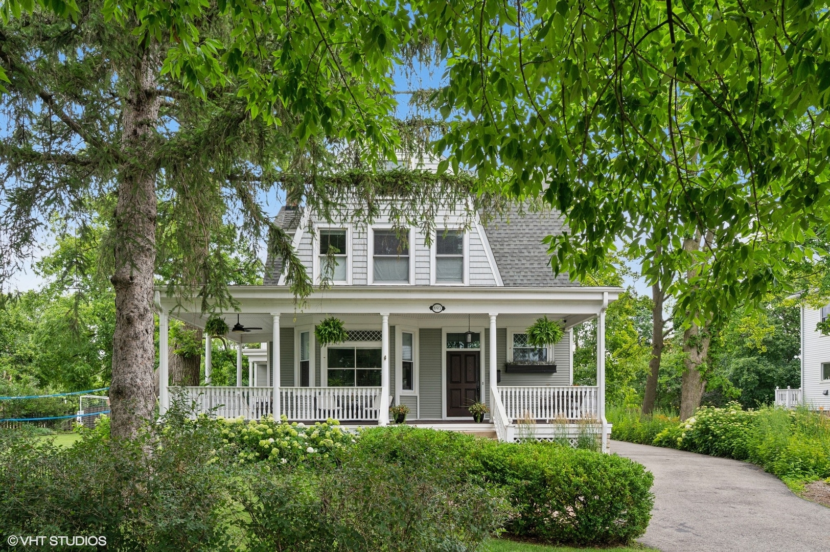 Outstanding charm and living space spanning four levels in this coveted IN-TOWN location! Expansive wrap-around front porch overlooks the park and side yard. Main level features high ceilings, hardwood floors, formal living room & dining room, updated kitchen with scullery/pantry and office. 2nd floor features Primary suite with updated bath and walk-in closet, 2 additional bedrooms plus office/exercise room/nursery and updated hall bath. Deck off the second level overlooks side and backyard. Third floor is a spacious tree-top retreat with a "lounge" area, 2 bedrooms and full bath. Basement offers additional recreation space, 6th bedroom, full bath and laundry. This is a terrific home for entertaining with great flow and flexibly on 1st floor. Dining room currently used billiard room. Office can also work as family room. Great flow from porch, patio, yard, family room to kitchen! Driveway access off Park AND Greenwood Avenues allows for easy in-and-out any time of day. Amazing location just steps to Central School, Hometown Coffee, Guildhall, Foodstuffs, Writer's Theatre and train. Come live in the special, boutique town!