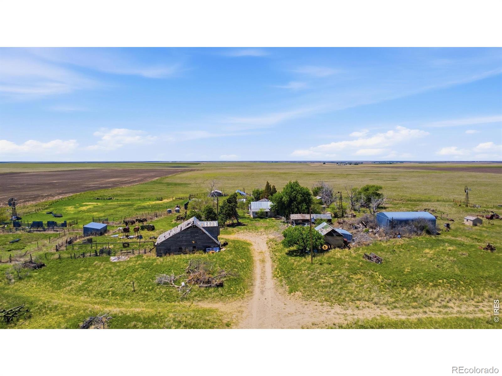 Become part of the story of this land! Versatile mixed-use agricultural farm featuring a mix of pasture ground, dryland acreage, livestock corrals, and an older homestead with renovation potential. Located in a quiet rural setting, the sunrises and sunsets just hit different! Offering functional agricultural improvements suitable for livestock operations, grazing, or hobby farming. Existing corrals and fenced acreage provide operational utility, while the established homesite offers future renovation or building possibilities. Excellent opportunity for agricultural use, investment, or rural recreation.