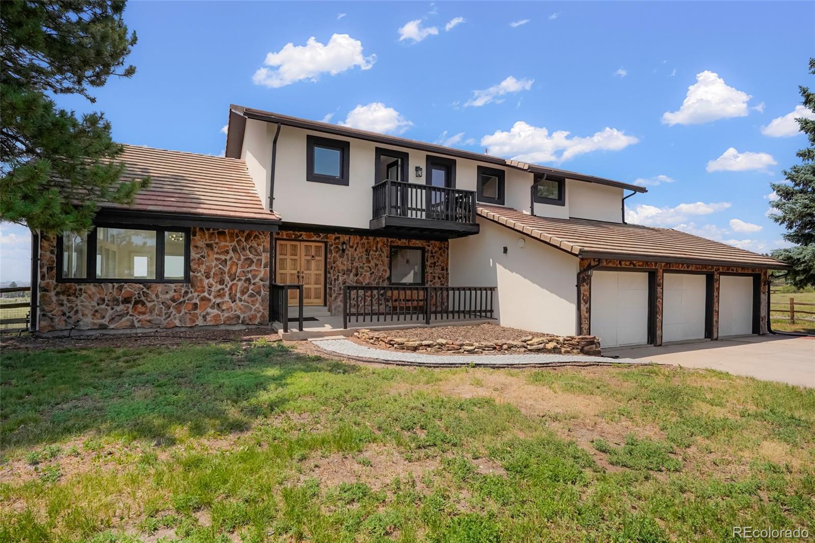 Exceptional opportunity in Parker's sought-after acreage community. Situated on 5.5 private acres, this beautifully remodeled 5-bedroom, 5-bath home offers 4,823 square feet of refined living space with breathtaking panoramic views of Colorado's western and southwestern mountain ranges. Extensive updates throughout include a new asphalt driveway, stucco exterior, Andersen windows and doors, wood flooring, staircase, paint, bathrooms, furnace, and air conditioning systems. The remodeled kitchen features new countertops, sink, faucet, gas range, and hood, creating a modern and inviting gathering space. Expansive windows capture stunning mountain vistas and abundant natural light, while the spacious floor plan provides flexibility for both everyday living and entertaining. Complete with a new LG washer and dryer, this move-in-ready property combines privacy and spectacular scenery just minutes from the amenities, shopping, dining, and recreation that make Parker one of Colorado's most desirable places to call home.