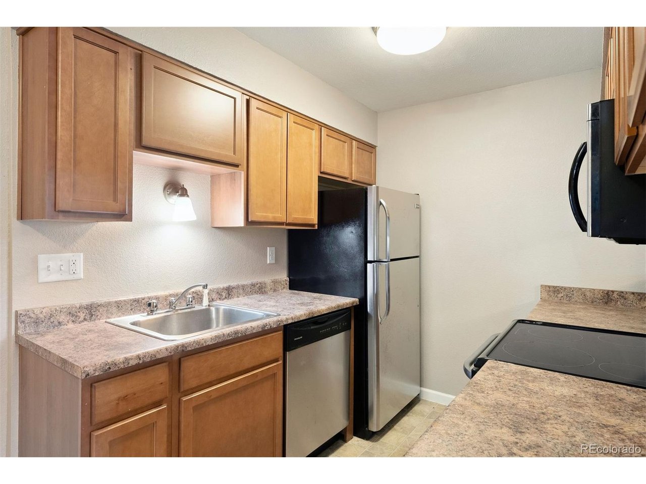 Live in Light, Luxury, and Location. Perfectly situated just steps away from Boulder's best dining, grocery stores, coffee shops, and fitness centers, this stunning 2-bedroom, 2-bathroom condo offers effortless living only 2 miles from CU Boulder-with seamless access to both downtown Boulder and Denver. Step inside to discover a beautifully appointed home where comfort meets style. The kitchen, living room, and private patio are all steps from the sparkling community pool. Thoughtfully designed, the unit includes a refrigerator, stove, dishwasher, and the convenience of an in-unit washer and dryer. Stay cozy on winter nights by the wood-burning fireplace and enjoy the year-round comfort of air conditioning. Sunlight floods the space from the south-facing windows, creating an atmosphere that is both vibrant and serene-a true sanctuary for reflection, creativity, or simply enjoying your morning coffee. Nestled within a welcoming community, residents enjoy access to a pool and beautifully maintained common areas-perfect for entertaining or unwinding. The HOA fee includes heat, water, sewer, and trash, offering peace of mind and practical ease. And yes-your furry companions are welcome here. Dogs? Absolutely. Cats? Of course. Because this isn't just a condo. It's a lifestyle. Don't miss the opportunity to make this light-filled, soul-soothing retreat your own.