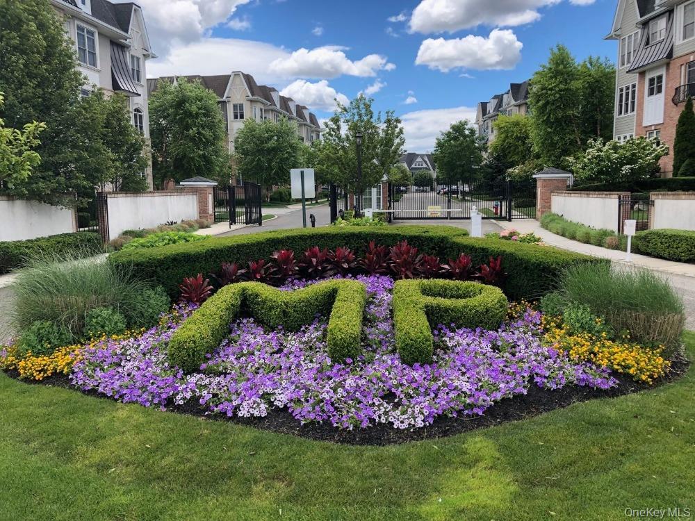 Welcome to luxury living at Meadowbrook Pointe in Westbury, NY! This stunning townhouse offers close to 2,700 square feet of elegance, convenience, and comfort in one of Long Island's most sought-after 48-and-over gated communities.Step inside to discover a sun-drenched open floor plan featuring hardwood floors, 12-foot ceilings, and designer finishes throughout. The modern kitchen is a chef's dream, boasting granite countertops, stainless steel appliances, and ample cabinet space—perfect for hosting intimate dinners or lively gatherings. The spacious living and dining areas flow seamlessly, leading to a private patio where you can enjoy your morning coffee.The primary suite is a true retreat, complete with a walk-in closet and a spa-like ensuite bathroom featuring double vanities and a luxurious soaking tub. The additional bedroom is generously sized for guests, and an additional flex space can be used as an additional bedroom or home office.Living at Meadowbrook Pointe also means access to unparalleled amenities, including your own private elevator, a state-of-the-art clubhouse, fitness center, indoor and outdoor pools, tennis courts, movie room, a Cafe and more. With beautifully landscaped grounds and 24/7 security, this community offers a serene, resort-like lifestyle just minutes from shopping, dining, and major transportation hubs.Don’t miss this rare opportunity to call Meadowbrook Pointe home. Schedule your private showing today and experience the best of Westbury living!