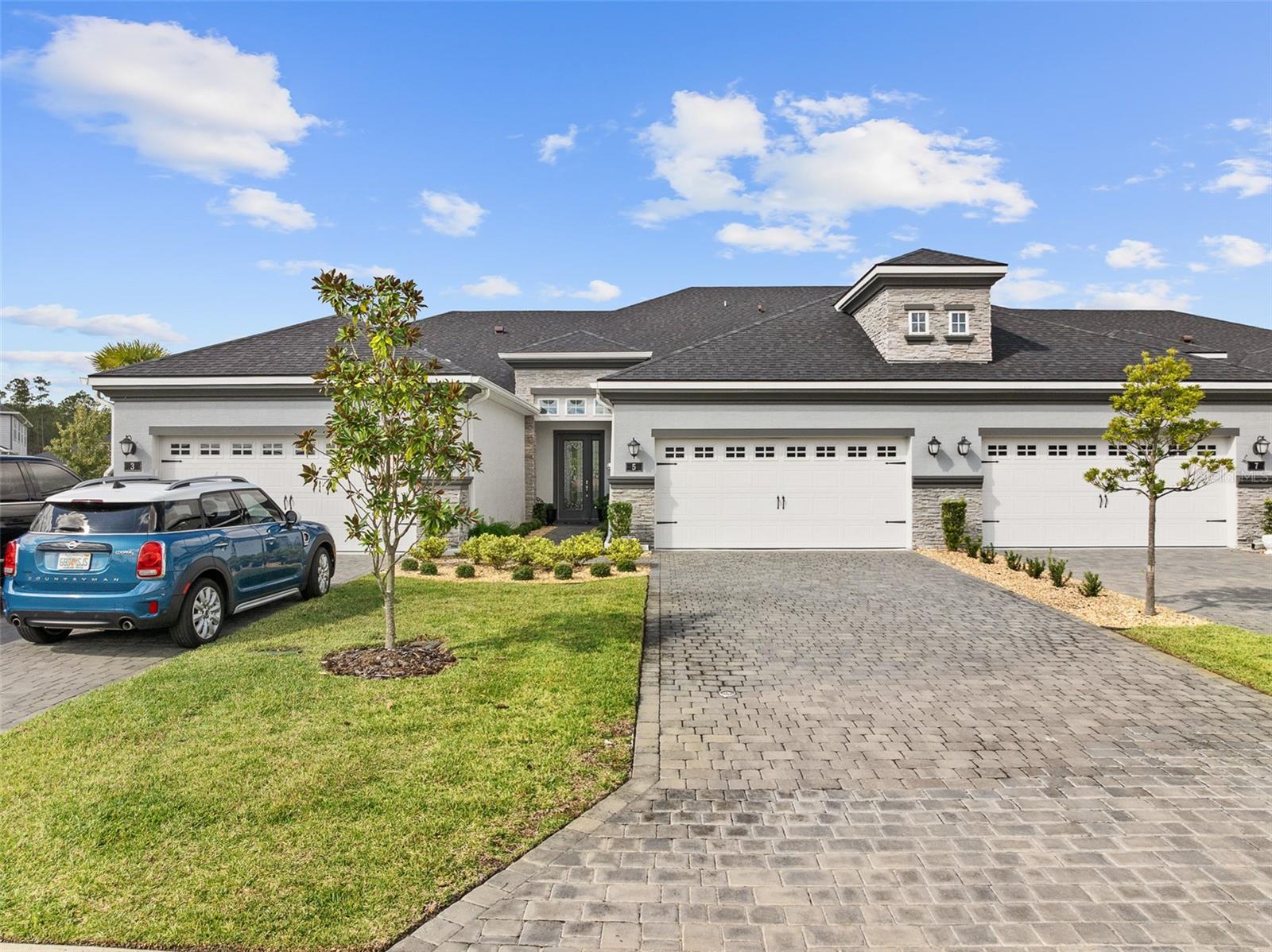 Welcome to this stunning, meticulously upgraded home in the heart of sought after Plantation Bay Golf and Country Club-where no detail has been overlooked and luxury meets everyday comfort. Boasting over $100,000 in PREMIUM UPGRADES, this residence showcases the perfect blend of elegance, functionality, and style. This home features an open-concept layout that seamlessly connects the living room, dining area and deluxe kitchen-perfect for entertaining or everyday living. the gourmet kitchen is a chef's dream, featuring soft-close custom cabinetry, elegant quartz countertops, a gorgeous tile backsplash, wall oven, slate appliances and an oversized kitchen island that offers extra cabinet storage. Every detail has been thoughtfully selected, including custom lighting and ceiling fans. Discover wood-look tile flooring throughout. The primary suite is on the main level creates a private retreat with an en suite bathroom boasting dual sinks, quartz counters, a walk-in shower, and a custom designed closet with a clever built-in storage under the staircase. Upstairs, you'll find a spacious bonus room and a second master suite, perfect for quests or multi-generational living. Enjoy tranquil mornings and relaxing evenings on your patio overlooking the sparkling pond and fountain, creating a peaceful backdrop to your everyday life. Enjoy peace of mind and convenience with electric hurricane shutters on the lanai, master bedroom, bonus room, and upstairs bedroom. The laundry room features cabinets, and the epoxy-finished garage includes built-in storage, keeping your space spotless and efficient. With meticulous upgrades and unmatched craftmanship, this home is truly move-in ready and one of a kind!Buyers of this home will receive a substantial discount onthe initiation fees when you join within 30 days of closing!