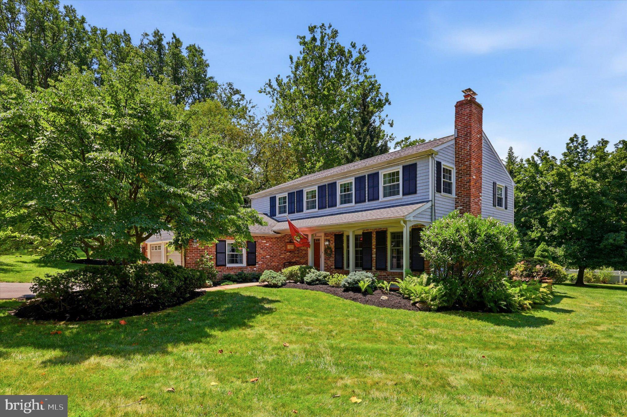 Nestled among mature trees and beautifully landscaped grounds, 809 Cloverly Road offers timeless character, spacious living, and a warm, welcoming atmosphere in one of Berwyn's most desirable neighborhoods. From the moment you arrive, the home's exceptional curb appeal makes a lasting impression, highlighted by an eclectic covered front porch, a beautiful flagstone walkway with a classic brick border, and professionally landscaped grounds that create a warm and inviting welcome.A gracious foyer welcomes you inside, where the sun-filled living room is anchored by a beautiful gas fireplace and oversized windows that flood the space with natural light. One of this home's most remarkable features is the abundance of sunlight that fills nearly every room. Flowing seamlessly into the formal dining room, a beautiful bay window creates an elegant setting for everyday meals or holiday gatherings.At the heart of the home, the spacious kitchen enjoys peaceful views of the beautifully landscaped backyard through a large picture window, creating a bright and inviting space to cook, gather, and connect. Well-appointed with granite countertops, a center island, two pantries, and a Sub-Zero refrigerator, the kitchen offers generous workspace and exceptional storage. Just beyond, the sunken family room provides a comfortable place to unwind, featuring sliding glass doors that open to the rear patio and expansive deck. Whether hosting friends outdoors, enjoying quiet mornings surrounded by mature landscaping, or relaxing on the patio or deck, the outdoor living spaces are a true extension of the home. A convenient first-floor laundry room with direct outdoor access and a powder room complete the main level.Upstairs, the spacious primary suite serves as a peaceful retreat, featuring a walk-in closet, a dedicated vanity area, and a private ensuite bath. The vanity area gives great potential for a primary bath expansion. Three additional generously sized bedrooms provide outstanding flexibility, while the two rear bedrooms beautifully showcase the home's exceptionally well-preserved hardwood flooring. Throughout much of the home, the hardwood floors have been beautifully preserved, reflecting the care this home has received over the years. A full hall bath, generous linen closet, and additional hallway storage add everyday convenience.The fully finished lower level expands the home's versatility with a spacious recreation room, private office, abundant storage, and multiple closets, providing endless possibilities for recreation, hobbies, fitness, or working from home. While this level offers an opportunity for cosmetic updating, it provides an exceptional amount of usable living space.Additional highlights include an attached two-car garage, a driveway accommodating three to four additional vehicles, abundant closets and storage throughout the home, and an incredible sense of space that is difficult to find. Offering generous room sizes and endless potential to personalize, this home provides the perfect opportunity to create your dream home while preserving its timeless character.Ideally located in the heart of the Main Line within the highly acclaimed Tredyffrin/Easttown School District, including Hillside Elementary and T/E Middle School, this exceptional location is just minutes from multiple SEPTA and Amtrak train stations, major commuter routes, shopping, dining, parks, and everything the Main Line has to offer.Thoughtfully maintained and filled with warmth, abundant natural light, beautiful landscaping, and spacious living areas, 809 Cloverly Road presents a rare opportunity to own a well-cared-for home with outstanding bones, exceptional space, and the chance to update and customize it to your own style for years to come.