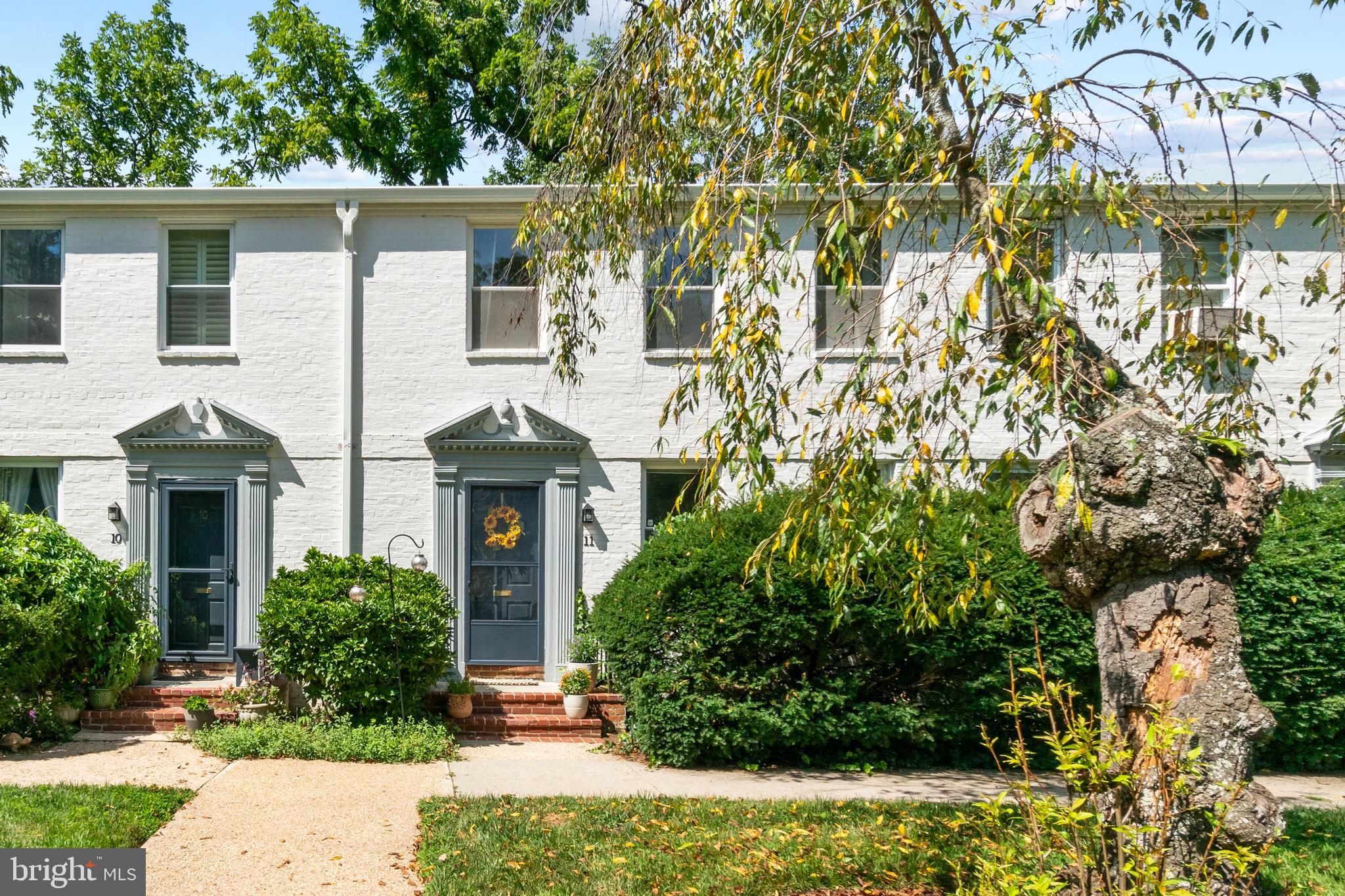 Condo fee includes exterior building maintenance, roof, lawn care, water, heat and reserved parking!!** The seller is willing to pay the special assessment which is $177 charge and ends in December.. Welcome to 5203 Falls Rd #11, a delightful Roland Park condo where timeless charm meets everyday comfort in one of Baltimore’s most prestigious and desirable neighborhoods! Tucked away in a peaceful, park-like setting, this charming two-level home offers a rare combination of privacy, character, and convenience. A beautiful courtyard leads you to the entrance, where you’ll immediately notice the home’s original hardwood floors, classic crown molding, and inviting sense of warmth. The spacious living room is filled with natural light from large windows, creating the perfect setting for relaxing or entertaining. The adjacent dining room offers plenty of room for memorable meals and gatherings, while the updated kitchen blends modern function with classic appeal. Featuring new cabinetry with glass-front doors, stainless steel appliances, granite countertops, and convenient fold-out tables for additional counter space, this kitchen is ready for your next culinary creation. Upstairs, you’ll find two generously sized bedrooms, both featuring beautiful hardwood flooring and abundant closet space. The primary bedroom adds personality with a stylish accent wall. The full bathroom showcases charming original hexagon tile and a glass-enclosed tub/shower combination, creating a timeless retreat. Additional highlights include a washer/dryer combo and central air conditioning—both rare and highly desirable features for this community. Plus new roof, and new boiler! Step outside through the back door and discover a serene yard surrounded by mature trees, offering a peaceful place to garden, unwind, or relax in a hammock. Enjoy the convenience of reserved parking and a condo fee that includes exterior building maintenance, roof, lawn care, water, heat, reserved parking, and more. Ideally located near Loyola University, Towson University, Sinai Hospital, Cross Keys, popular restaurants and shops, and Downtown Baltimore, this home puts everything you need within easy reach. Don’t miss your opportunity to own a piece of charming Roland Park living in a truly special setting! **Condo fee includes exterior building maintenance, roof, lawn care, water, heat and reserved parking!!**