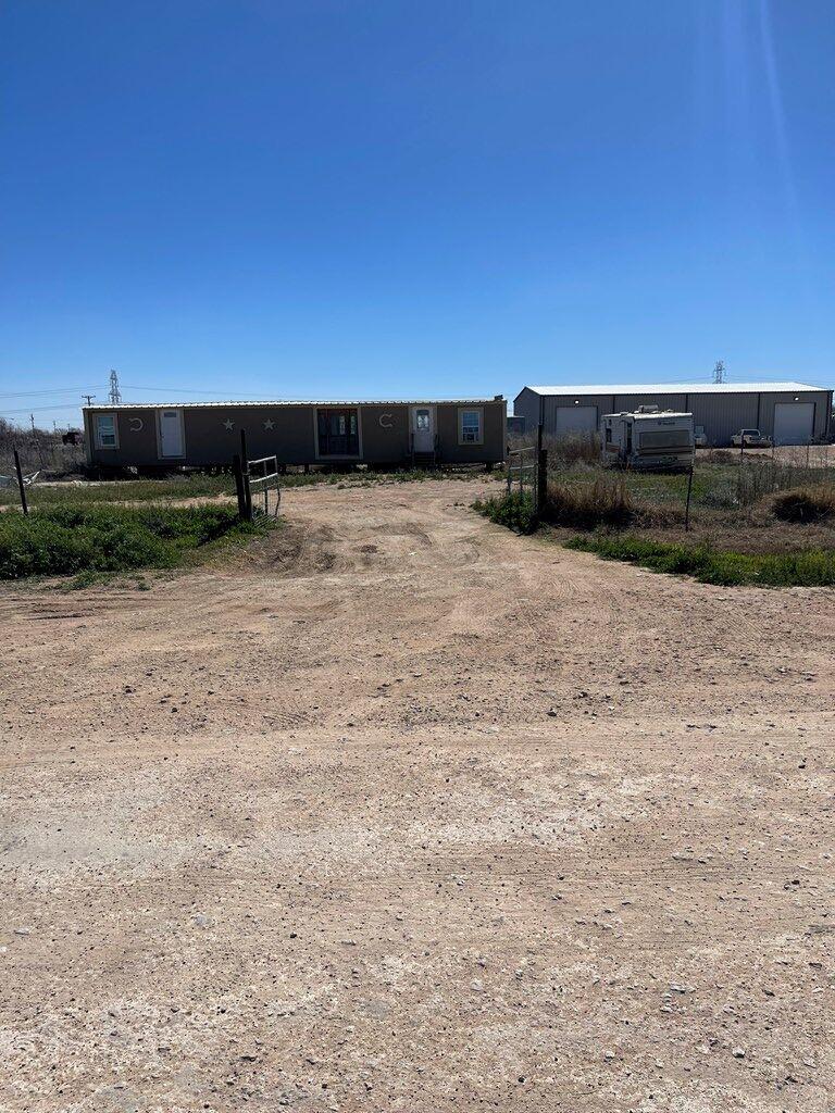 THIS IS AN AMAZING CORNER ACRE WITH MOILE HOME  UNKNOWN CONDITION, NOT WARRANT.  ONE WATER WELL, TWO ELECTRICAL POLE. BRING YOUR FARM ANIMALS, TRACTORS, OR START YOUR OWN MAN CAMP, RV PARKING, ETC