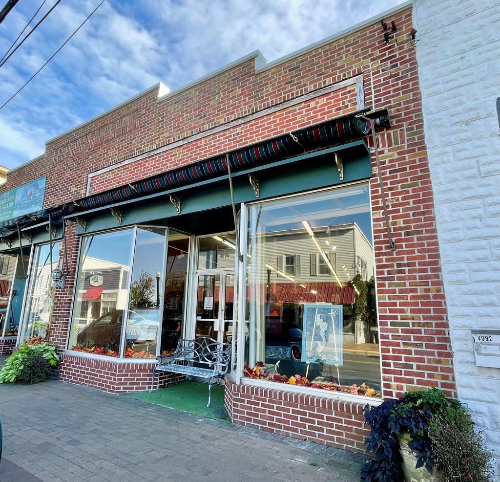 Prime downtown location, rich in Island history, fond memories of Ben Franklin days! Lovely brick front exterior with oversized windows on both sides of entrance, great display showcase! High ceiling inside enhances the retail space. Two additional rooms for inventory storage, office space and bath with rear access door. Main room retail space approx 90X21, could be made into more than one room. Great location for shoppers to pop in while enjoying Downtown on the Island with the other shops. Across the street from the waterfront park & Misty statue! Free Parking behind! Nice grassy rear space with neighbors shade tree, perfect for a middle of the work day place to relax. Rubber roof approx 5 years old. Parcel being split into two, only South side for sale. Seller to install firewall.