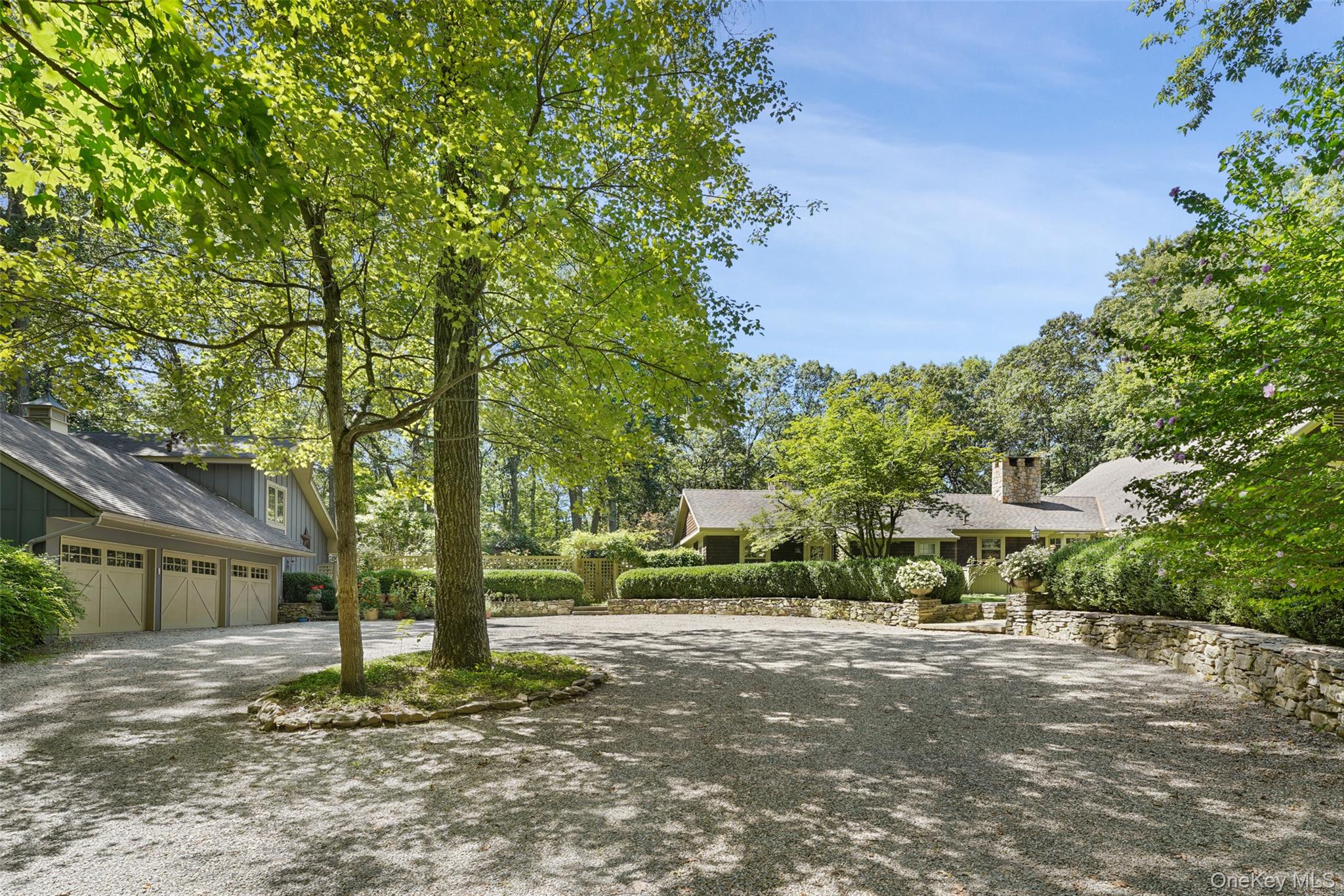 This stunning contemporary ranch blends refined design with effortless comfort. The heart of the home is a high-end chef's kitchen featuring sleek finishes, premium appliances, and elegant open shelving. The kitchen flows seamlessly into  a formal dining room with built ins an expansive living room/ FPL with vaulted ceilings. French doors open gracefully to beautifully landscaped gardens.A warm and inviting family room with a stone FPL provides the perfect setting for cozy evenings.The renovate primary suite is a true retreat, complete with spa-inspired bath and steam shower showcasing luxurious finishes and thoughtful design.Three additional bedrooms and one with a private bath offers flexibility for guests , while a dedicated office provides an ideal work from home space.Adding exceptional value and versatility a separate legal cottage offers its own private haven.With a living room with high ceilings a kitchen area, stairs to a loft bedroom with bath, washer and dryer and doors that open to a private terrace sq ft of cottage is 625, house is 3697.In addition there is a three car garage with pull down stairs with great expansion area, large fenced in vegetable garden, deer fencing around the back of the property and an automatic generator.This home is a rare blend of contemporary elegance, comfort, and indoor -outdoor at its best, there is also space for a pool. The owner is a landscape designer and the roof has heated coils. The house has a five bedroom septic.