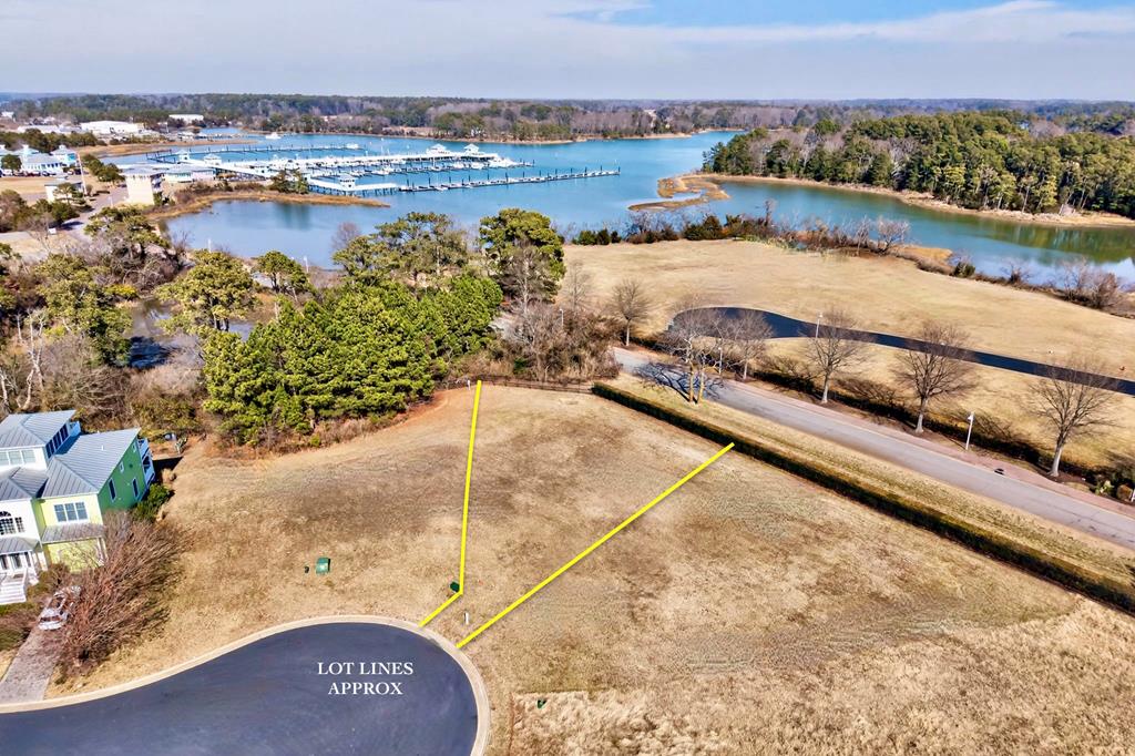 Homesite-#150 in the Kings Bay Village section of Bay Creek is a beautiful .25-acre homesite offering the perfect buy now, build later opportunity in this private gated Bay Creek community. Secure your slice of the Eastern Shore and design your dream coastal home on your timeline. Located near Kings Creek Marina, enjoy effortless access to boating, sunset cruises, and bay breezes. HOA amenities include private beach access, pools and more. Just a short golf cart ride to Cape Charles' Historic Downtown filled with boutique shopping, restaurants, theatre, ice cream stops, and seaside charm.