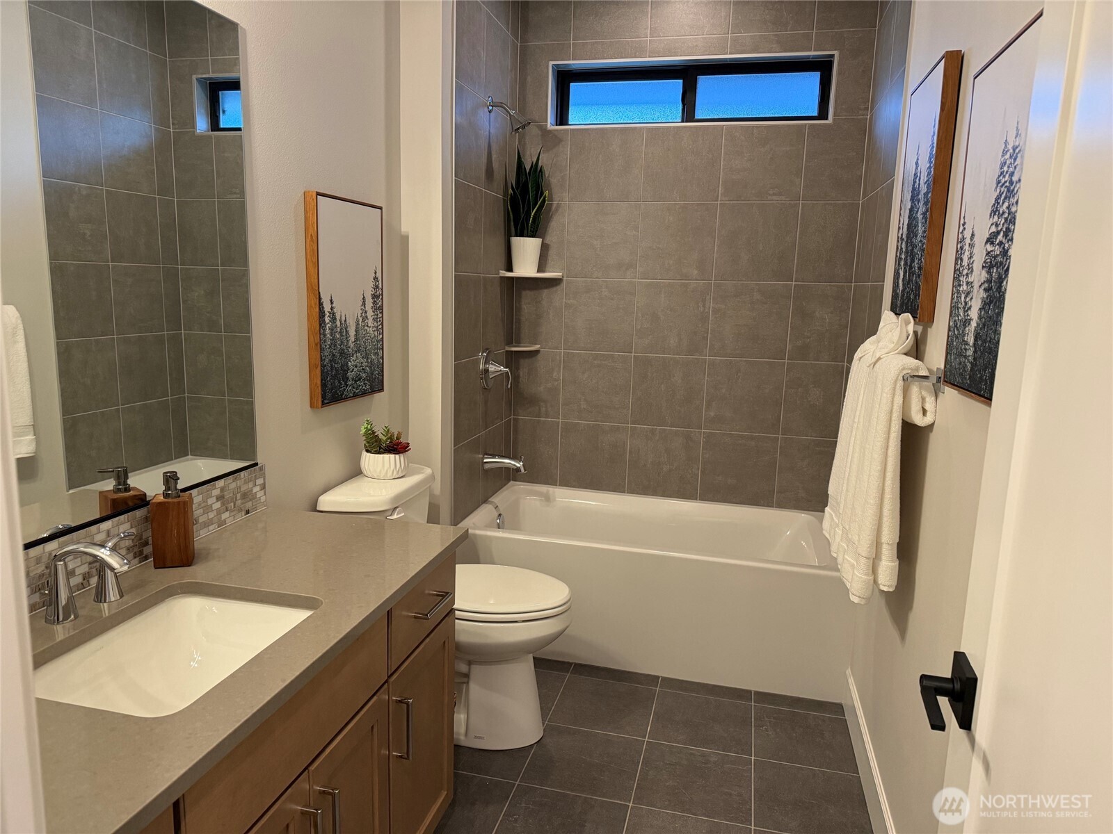 A conveniently located full hall bathroom serves the  bedroom, providing plenty of space and easy access for family and guests.