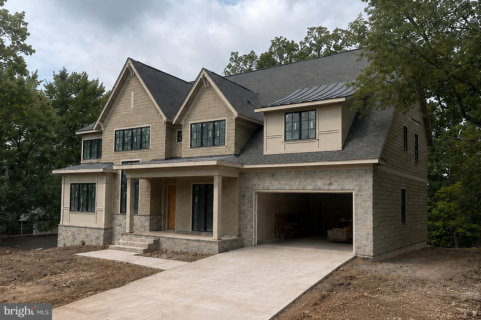 Currently under construction by BCN Homes in the heart of Country Club Hills, one of North Arlington’s most established and sought-after neighborhoods, this exceptional 8,000+ square-foot residence pairs timeless architecture with sophisticated, highly considered design. Set on a quiet, tree-lined cul-de-sac surrounded by substantial homes and mature landscaping, the property offers a rare sense of privacy while remaining just minutes from Washington, DC, Tysons, and the conveniences of North Arlington. The home features 6 bedrooms, 6 full and 3 half baths, a 3-car garage, and expansive indoor-outdoor living across a thoughtfully planned floor plan. Available for private tours, the residence is anticipated for Fall 2026 completion, with white oak flooring now being installed and custom painting underway.The open main level is defined by dramatic scale and architectural detail, including a two-story vaulted family room centered around a statement plaster fireplace, wood-applied vaulted ceiling, and expansive windows overlooking the rear grounds. A gracious foyer opens to a striking dining room with floor-to-ceiling windows, while a private study with custom built-ins offers a refined work-from-home retreat. A separate parlor, also featuring built-ins and a distinctive fireplace, connects seamlessly to the main living spaces and offers exceptional flexibility as a formal sitting room, second study, playroom, or alternate main-level bedroom.At the center of the home, the gourmet kitchen is designed for both everyday living and large-scale entertaining, with an oversized island, 48-inch range, dual dishwashers, and a butler’s pantry with handcrafted cabinetry. Tucked discreetly beyond the main living spaces, the mudroom provides direct access to the three-car garage and backyard and is outfitted with custom cubbies and bench seating, a workstation, secondary powder room, and rear staircase—an unusually functional transition space executed with the same level of finish as the rest of the home.Upstairs, a generous lounge leads to the private primary suite, where vaulted ceilings, treetop views, and a high degree of privacy create a true retreat. The spa-inspired bath features a freestanding soaking tub set within a marble-tiled alcove, steam shower, heated tile floors, and beautifully built-out dual walk-in closets. Four additional bedrooms, each with an ensuite bath, along with a thoughtfully designed laundry room, complete the level.The lower level is equally compelling, with a bright recreation room opening directly to a covered grotto lounge and patio. An entertainer’s bar, wine room, fully outfitted wellness room with optional sauna, and dedicated theater, golf simulator, or storage space create tremendous flexibility. A private guest suite offers ideal accommodations for long-term guests or an au pair, complemented by an additional powder room.Set on a 16,000+ square-foot corner lot, the outdoor living opportunities are just as compelling. A screened porch, elevated deck, and covered grotto lounge overlook a substantial backyard with room for a pool, spa, or even a two-story pool house/garage combination. Importantly, the property extends well beyond the current construction fencing into the rear tree line, creating significantly more usable yard and privacy than is immediately apparent from the street. The resulting sense of privacy is especially striking from within the residence and is best appreciated in person.Crafted by BCN Homes, known for exceptional quality, enduring design, and meticulous attention to detail, the residence also prioritizes comfort, efficiency, and performance. A high-performance HVAC system, tankless water heaters, and generator prewire are among the systems thoughtfully incorporated into the home.