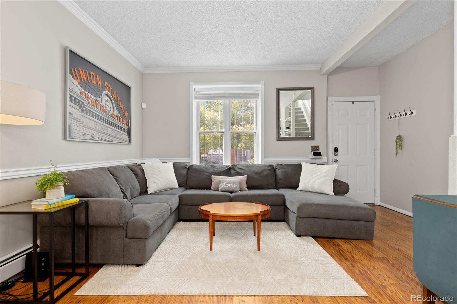 Charming 3 bedroom, 2 bathroom half duplex in Denver’s vibrant Whittier neighborhood.
Step inside to discover a bright and spacious layout with plenty of natural light. The open living, kitchen and dining areas create an easy flow for everyday living and entertaining. The kitchen is well-appointed, featuring ample counter space including seating for 3 at the breakfast bar, new countertops and storage galore.  Upstairs you will find 3 bedrooms, one with a walk out balcony, as well as a full bath.  In the finished basement you'll find an additional living space , providing flexibility to create your ideal setup—whether it’s a home office, media room, play room or home gym. Outside, enjoy your private backyard oasis—perfect for relaxing or hosting summer gatherings. You'll feel right at home in this peaceful outdoor space. Situated in Whittier, you'll be just minutes from local favorites like coffee shops, restaurants, parks, and public transit, offering the perfect blend of urban convenience and neighborhood charm. With no HOA and your own private outdoor space, you can't beat the value.