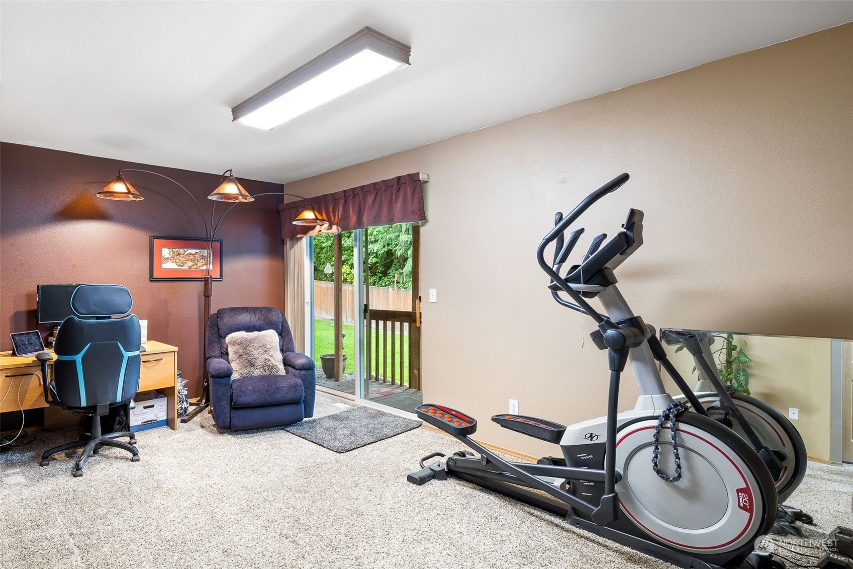 Unit B - Extra living / TV / Office / fitness room downstairs with entry from garage.