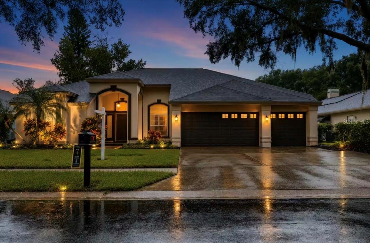 Welcome home to this stunningly updated 4-bedroom, 3-bath executive pool home in the heart of the East Lake Corridor. Situated on a desirable cul-de-sac, this residence features an open, split-bedroom floor plan designed for comfortable living and effortless entertaining.The gourmet-style kitchen showcases a large island, spacious dining area, and seamless connection to the family room. Sliding doors lead to the resort-style pool and spa area, complete with a fully equipped outdoor bar—perfect for entertaining family and friends.The luxurious primary suite offers a beautifully appointed en-suite bathroom with a walk-in shower, dual-sink vanity, freestanding tub, and a spacious walk-in closet with custom built-ins. A dining room and living room combination, two additional bedrooms with a shared full bath, and a private rear bedroom suite with access to the pool bath and pool area provide plenty of flexibility for family and guests.An interior laundry room and oversized three-car garage complete this exceptional home. Located in an A-rated school district with Lansbrook Commons Park directly across the street, this home offers the best of the Lansbrook lifestyle. Come experience all that Lansbrook has to offer!