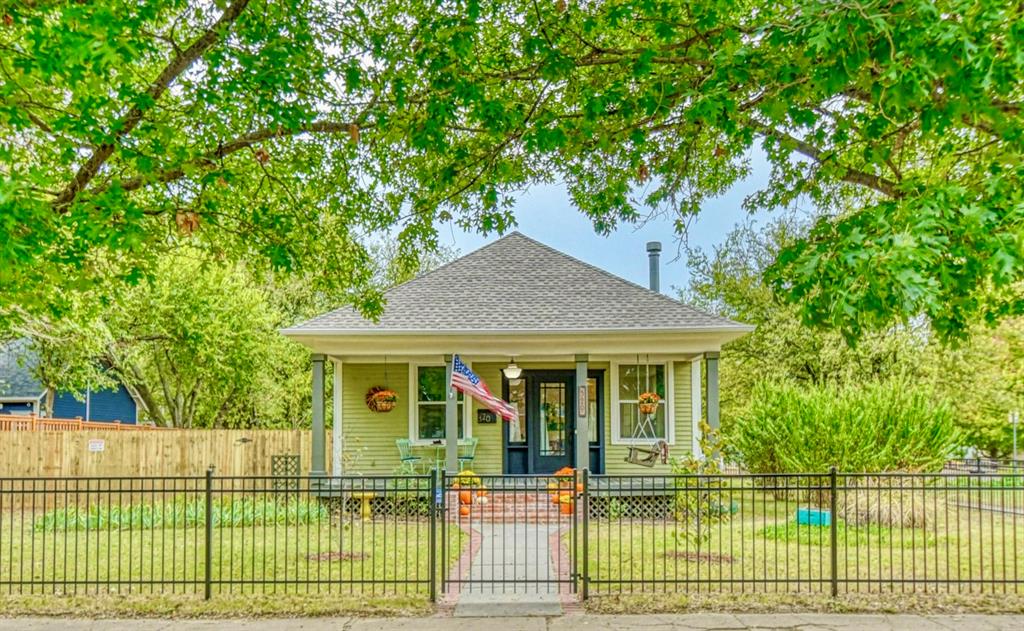 Step back in time — right in the heart of Norman’s Historic Silk Stocking District.
This 100-year-old downtown bungalow has all the charm and character of a simpler era, yet it’s been lovingly updated for modern living. Picture tree-lined streets, a big front porch with a swing, and evenings that end under the stars around a cozy firepit. It’s the kind of home where you half expect to hear a piano playing and see “Marian the Librarian” reading by the window.
Inside, tall ceilings and new energy-efficient windows fill the rooms with natural light. The renovated kitchen features new countertops, backsplash, and stainless steel appliances — with original built-ins that keep the home’s vintage soul intact. The gas fireplace in the living room looks right out of 1925 but works with the touch of a remote.
The private third bedroom has its own entrance, bath, and sitting area — perfect for guests, an Airbnb, or a quiet home office. Both bathrooms have been beautifully updated, and the original wood floors tie everything together with warmth and character.
Out back, a large deck feels like your own retreat — ideal for morning coffee, weekend cookouts, or fall gatherings under the trees. There’s also a small artist studio (96 sq ft, not in total footage) bathed in natural light — a perfect spot for creativity or quiet reflection.
With its newer roof and decking, custom iron fence, and prime location just a short walk to downtown shops, restaurants and bars, farmer's market and our ever-expanding cultural/arts district — this home doesn’t just offer a place to live. It offers a lifestyle — one that feels timeless, peaceful, and perfectly Norman.