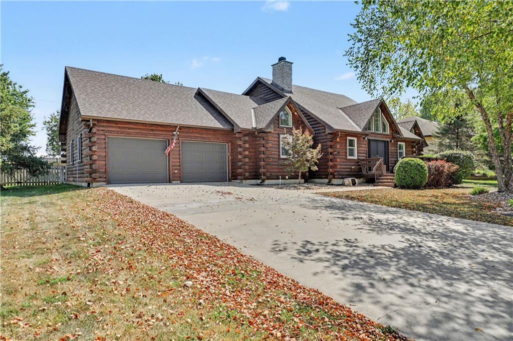 A ONE-OF-A-KIND LAKE WINNEBAGO RETREAT! Prepare to fall in love with this truly extraordinary log cabin. From the moment you step through the impressive double front doors, you are welcomed into a breathtaking great room with soaring ceilings, rich wood walls, exposed wood beams, and a dramatic floor-to-ceiling stone fireplace that immediately captures the essence of this spectacular retreat. The great room flows effortlessly into the spacious kitchen, complete with a large island, granite countertops, abundant cabinetry, and stainless-steel appliances. Just off the kitchen, the dining area features a convenient wet bar and additional cabinetry, while the adjoining family room offers even more space to relax around a second fireplace. Whether you're entertaining a crowd or enjoying a quiet evening at home, there is room for everyone.Step outside and embrace the lake lifestyle from your screened-in porch and no neighbor back yard view. The truly special part—your own private boat dock directly across the street! Positioned on the main channel with deep water, the dock features a boat lift and diving platform, making it incredibly easy to spend your days boating, swimming and fishing. The unique loft-style primary suite creates a private retreat, while two additional bedrooms and a full bath are conveniently located on the main level. The finished lower level provides a fourth bedroom, spacious 2nd family room, exercise room/office, and full bath. Spend the afternoon on the water, gather with friends at the Yacht Club for dinner, explore the walking trails, let the kids enjoy the playground, or saddle up at the nearby horse stables. Enjoy tennis, pickleball, basketball, and the new community pool—all while having your own private piece of the lake lifestyle.Rarely does a property offer this much character, space, lifestyle, and direct access to Lake Winnebago. This is truly a one-of-a-kind opportunity to own a piece of the lake life.