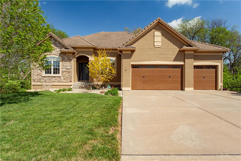 Step into quality, comfort, and exceptional space in this former model home. Soaring 12-foot ceilings, remarkable millwork and crown molding and abundant natural light create an inviting atmosphere throughout. The kitchen is both functional and beautiful, showcasing solid wood cabinetry, a newer Bosch dishwasher, microwave, smart oven and an oversized walk-in pantry that provides incredible storage. The primary suite is a private retreat with its own deck access, split vanities, a jetted tub and a huge double-headed shower. A second bedroom on the main level provides flexibility for family, guests or a home office. The finished lower level expands your living space with a large family room with pool table, wet bar, two additional bedrooms and a full bath. The "dry below the deck" patio offers a comfortable place to watch a game, entertain guests or unwind outdoors while staying protected from the elements. There is added privacy with green space directly east of the home, creating peaceful views and an open feel. Major upgrades include a concrete tile roof, newer exterior paint and HVAC system. As a bonus you have all of the amenities of Lakewood, including boating, fishing, golf, three swimming pools, tennis courts, pickleball court, walking trails and more. This home offers the perfect blend of space, updates, and lifestyle!