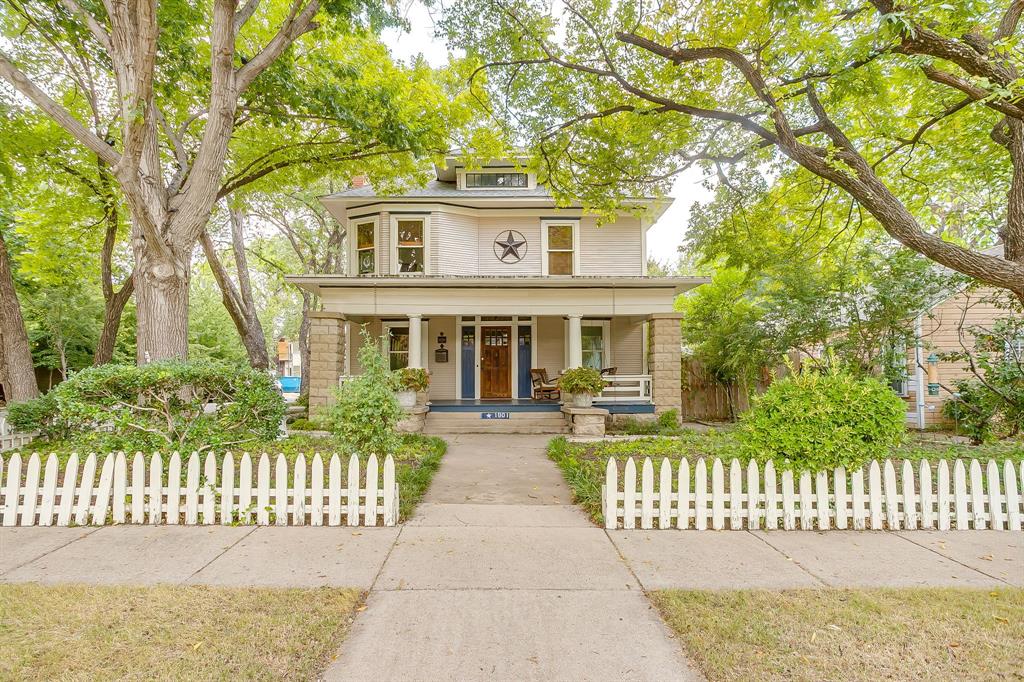 Timeless style greets you with this historic American Foursquare home featuring 3 bedrooms, 2 bathrooms, and an upstairs bonus room. Set on a desirable corner lot with a classic white picket fence, this home exudes charm and history.  Sunlight fills the rooms through beautifully framed windows, highlighting original wood floors, crown moldings, and a staircase that anchors the home and showcases its character.

The layout offers plenty of space for dining, entertaining, and everyday living with two living spaces and dining space as well as an eat in kitchen. The front porch welcomes neighbors.  A large walk in primary closet is also a feature.  A detached studio garage apartment provides an excellent opportunity for guests or additional rental income, while a separate studio space offers flexibility for an art studio, workshop, or home office.  The backyard is very private and secluded.  

Set in the middle of Fort Worth's historic Fairmount neighborhood, the home is a short walk from Magnolia Avenue’s shops, restaurants, and coffee houses, and minutes from downtown, TCU, or Texas A&M's coming soon campus.  The Fairmount neighborhood is an historic district and there are guidelines that must be followed and changes must be approved for any alterations to the exterior of houses within the neighborhood. 

Showings to start Saturday, August 30.