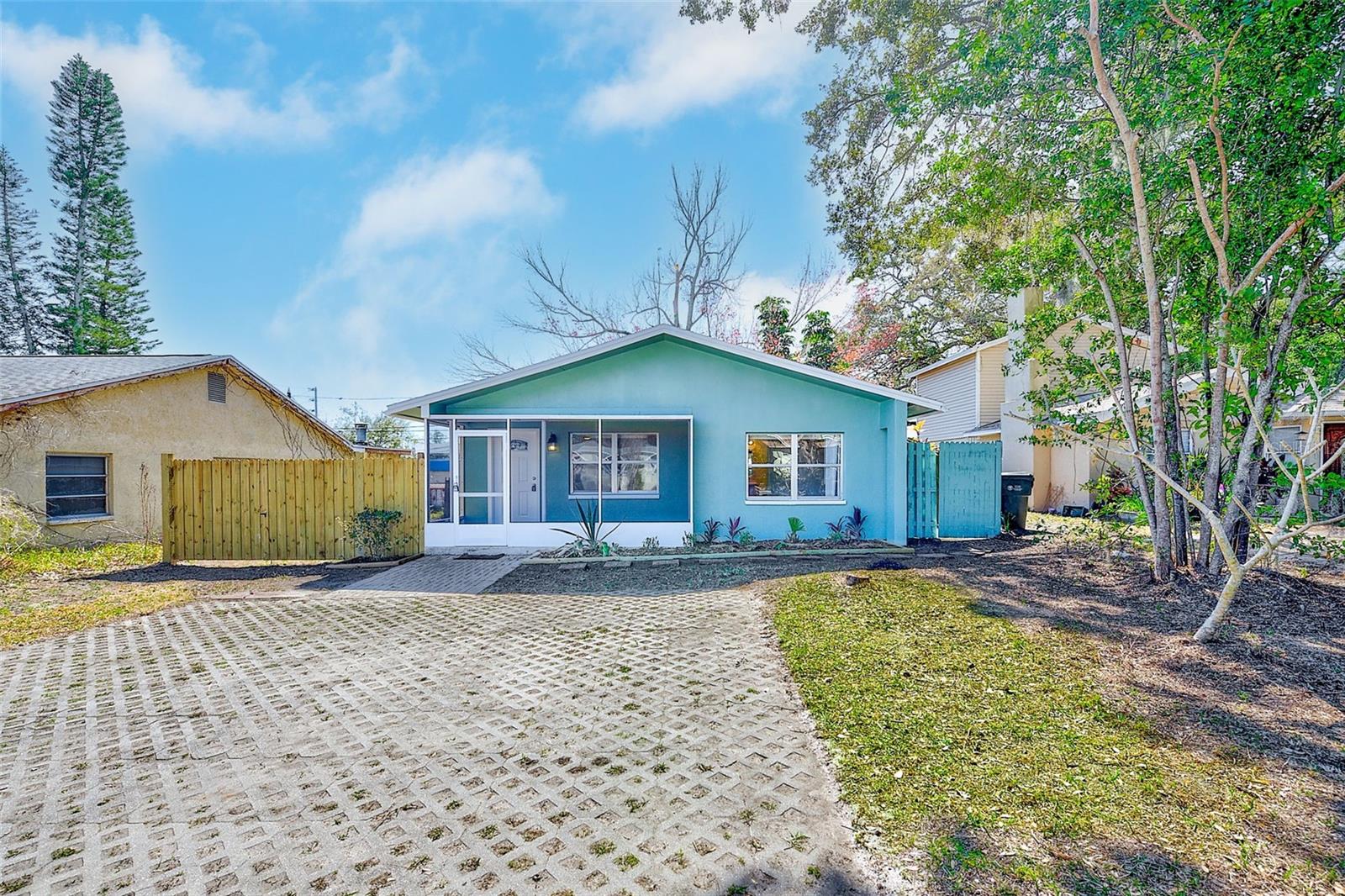 Welcome to this beautifully remodeled 2-bedroom, 2-bathroom block home in the heart of Largo—where modern updates meet everyday comfort and endless potential. From the moment you arrive, you’ll appreciate the fresh interior and exterior paint, giving the home a clean, contemporary feel. Inside, new flooring and baseboards flow seamlessly throughout, complemented by updated fixtures that add a polished touch to every room. The stylish kitchen is designed to impress, featuring brand-new quartz countertops, stainless steel appliances, and an inviting eat-in counter that opens to the family room—perfect for entertaining or casual dining. Both bedrooms are generously sized and feature walk-in closets, with one bedroom offering two closets for exceptional storage. The bathrooms have been tastefully refreshed with new vanities, toilets, and beautifully tiled showers, creating a spa-like atmosphere. A large interior laundry room provides additional storage and convenience, and the tankless water heater ensures energy efficiency. Major systems offer peace of mind with a 2024 roof and an A/C system approximately one year old. Step outside to a spacious backyard with incredible opportunity—zoned for an Accessory Dwelling Unit (ADU) up to 800 square feet. Whether you envision a guest cottage, income-producing rental, or private studio, the possibilities are endless. A long driveway accommodates multiple vehicles, and the property sits high and dry outside of any flood zone—no flood insurance required. Centrally located just minutes from shopping and dining, close to beautiful Largo Park, and only about 10 minutes to the beaches, this home truly offers the best of Florida living. Whether you’re searching for a move-in-ready primary residence or a smart investment with expansion potential, this property is priced to sell and ready for its next chapter.