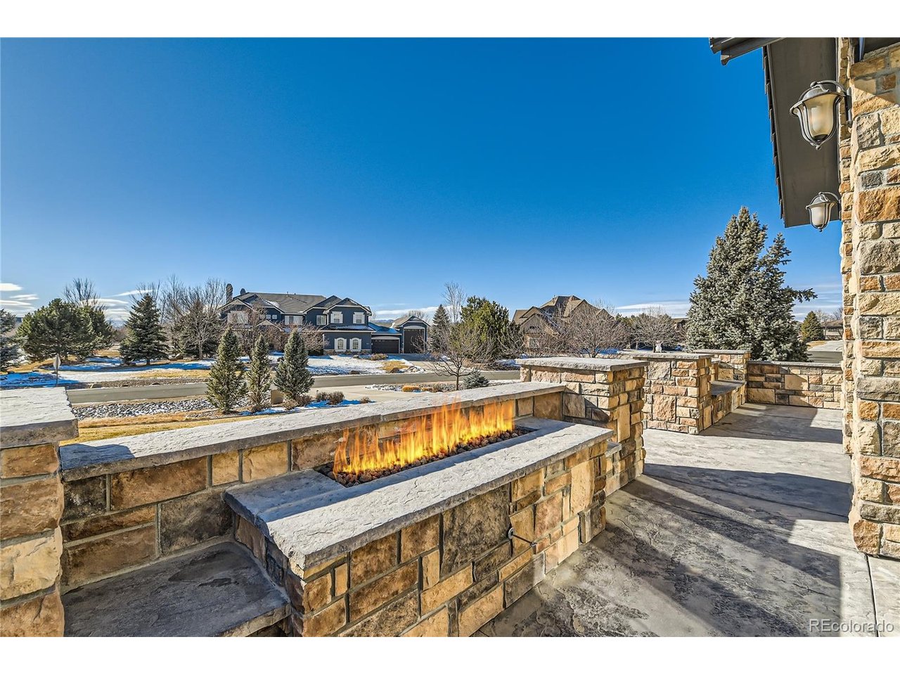 Unrivaled space and natural beauty define this 1.39-acre luxury estate. Surrounded by vibrant, mature landscaping, the extensive yard provides a picturesque setting for sports, recreation, and relaxation. Imagine hosting summer barbecues on the expansive patio complete with firepit. Ample space for the addition of future pool and sports court, further enhancing the outdoor living experience. Welcoming front courtyard with linear firepit invites relaxation while enjoying panoramic mountain and city vistas. Step inside to discover an interior that seamlessly blends elegance and functionality. Thoughtfully designed floor plan crafted with everyday living in mind. Chef's dream kitchen features stylish quartz island, and Thermador appliances. Cozy breakfast nook has glass doors to the backyard patio creating a seamless indoor-outdoor living experience. Expansive great room is graced with a wall of windows, two-story coffered ceilings and fireplace. Secluded study offers backyard views and tranquil ambiance. Spacious main level mudroom with secondary laundry. Ascend to the upper level to discover a primary sanctuary featuring cozy sitting nook, and spa-inspired bath. Three additional en-suite bedrooms offer comfort and privacy, while the roomy upper level laundry room adds convenience. Lower-level features spacious rec room with wet bar and climate-controlled wine cellar designed to showcase any discerning wine connoisseur's collection. Exercise room provides dedicated space for fitness enthusiasts, while an additional guest bedroom offers flexibility. Enjoy the tranquility of spacious living with convenient proximity to shopping, dining, entertainment, public, private schools and effortless access to Denver, Boulder, DIA, and Northern Colorado. This is more than just a home, it's a lifestyle.....AI-generated pool concept in photo offers a glimpse into exciting possibilities for future backyard designs. Potential future pool is not included in sales price.