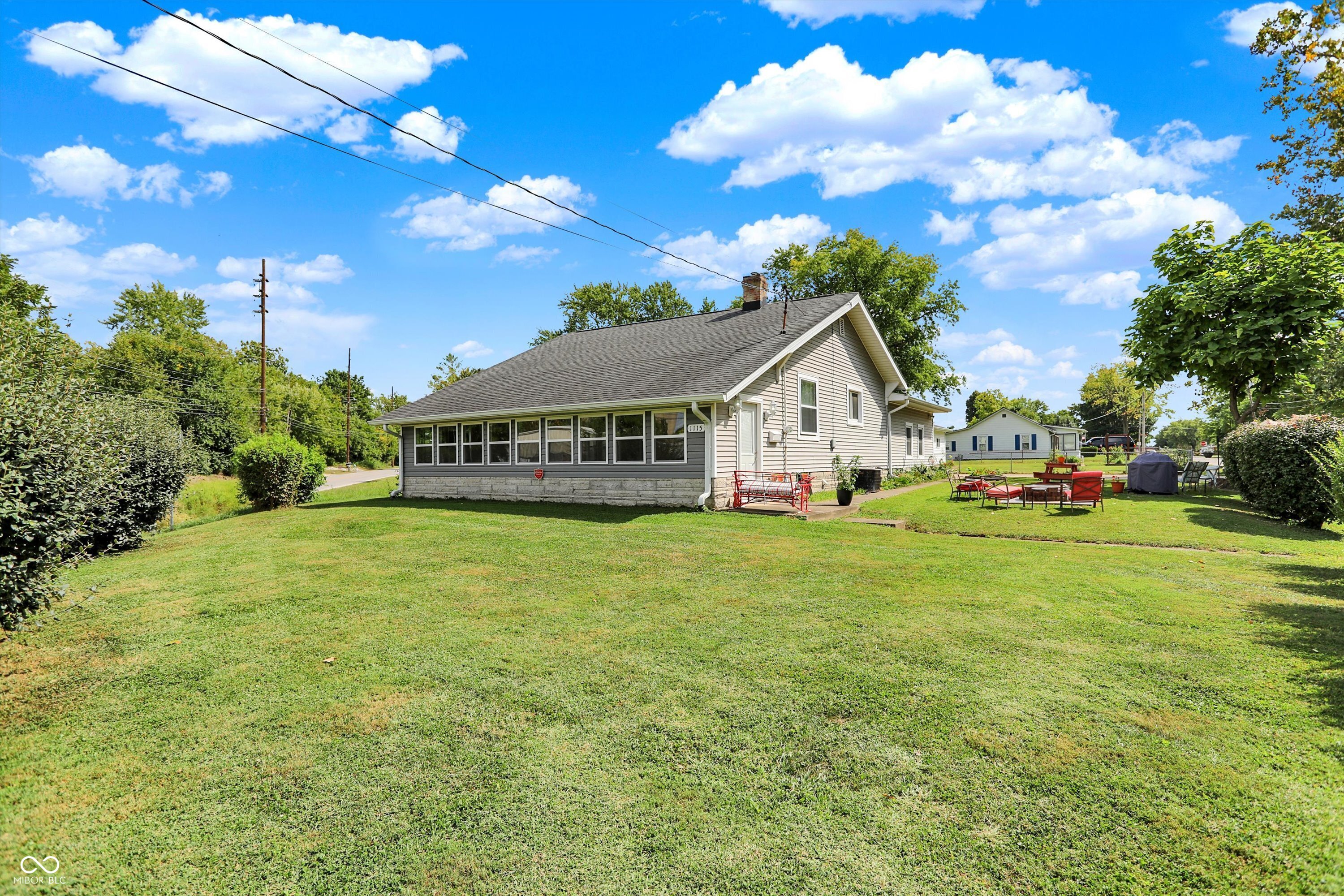 A rare 4 bedroom, 2400 sq ft + find in Beech Grove. This beauty has so much to offer!! Walking distance to several schools, churches, library, parks, Franciscan trail and Main Street!!   Large great room can be used for any purpose ; family gatherings, in-law quarters, office, mud room , anything your heart desires. Formal dining room, large bedrooms, formal living room and the perfect outdoor oasis. Spend evenings in the large fenced yard (over .65 acres to be exact) or relaxing in the heated and cool sunroom .  Updates include; newer windows throughout, updated flooring in living and bedrooms, stainless steel kitchen appliances and newer exterior doors. A beautiful and producing garden, outdoor 2 car garage, storage shed and so much more. This quiet location is across the street from the Benedict Inn making for even more peaceful surrounding. You won't want to miss this one!