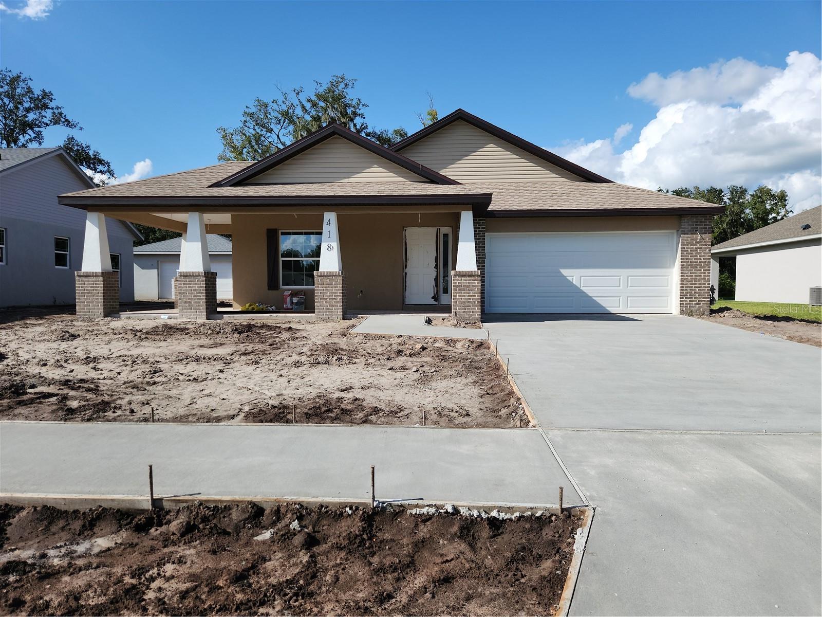 Under Construction. The Craftsman inspired Orange Blossom II, quality construction on a water view site with NO backyard neighbors.  Spacious open floor plan.  Primary suite has TWO walk in closets, en-suite bath features dual sinks, garden tub and huge shower. Laundry room with tub sink.  COMPARE OUR QUALITY, VALUE AND INCLUDED FEATURES! (1) HUGE 75X147 ft homesite.(2) Granite counter tops in kitchen and baths (3) Custom quality all wood cabinets with dove-tail joints and soft close drawers. (4) Foam filled BLOCK walls, reflective roof panels (5) Exterior grade weather resistant bead board on porch ceilings (6) Pillars and widow trim are REAL, NO fake foam (7) REAL hand laid full size brick, NOT fake facing or stucco (8) Cement board behind bath tile, and underlayment on floor tile (9) Natural gas port on back lanai for for future grill and/or pool/spa heater. (10) Lighting package includes exterior coach lights, yard light, TWO florescent garage lights (11) Garage door opener (12) Whole yard sprinkler system and landscaped. Minutes from either Alexander-Buchman Rd and Park Rd I-4 exits!! Boats or RV's ALLOWED parked in rear yard!! Fees only $350/ YEAR!! NO CDD!! NO "LOT PREMIUMS" added to your price!! Built by local independent, quality minded builder, building in Florida since 1979. He is often on site, overseeing every detail. Shannon Estates is the CURE for cookie-cutter sub-division boredom, every home in this intimate 23 home community is unique and special!! AGENTS: SEE IMPORTANT INFO IN MLS REALTOR REMARKS