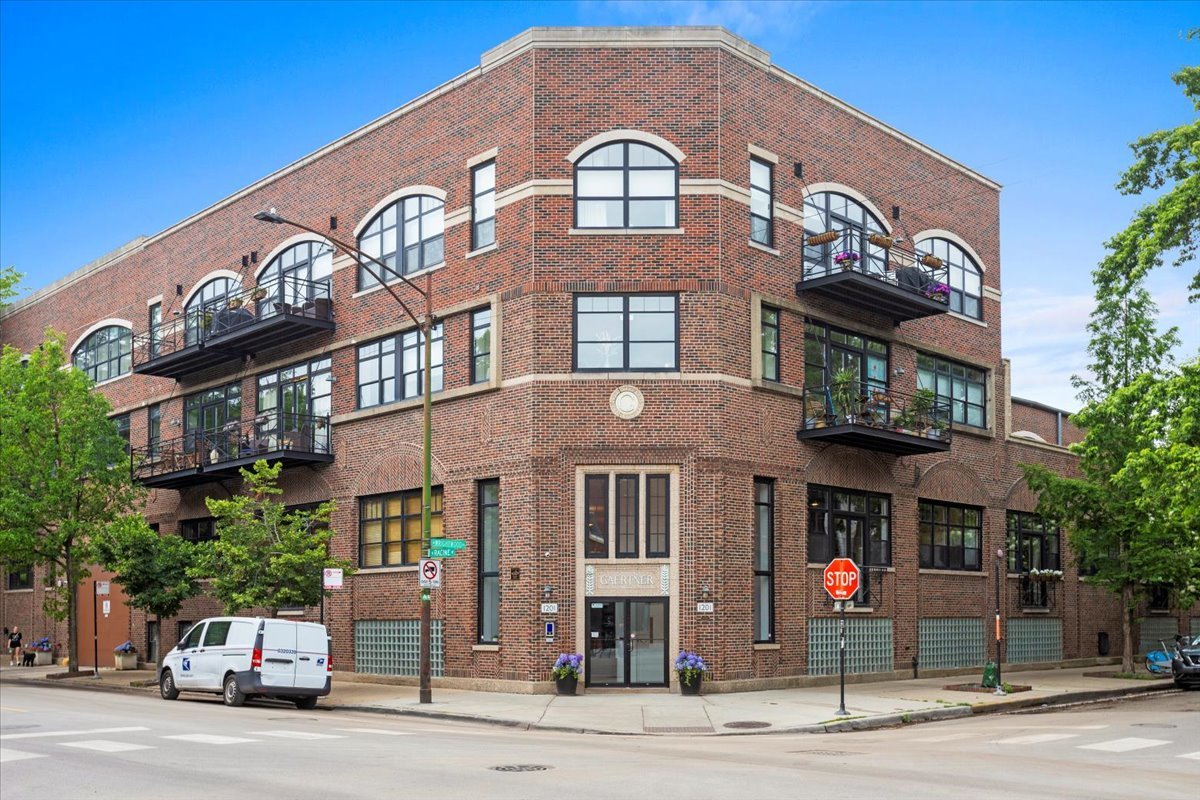 Elegant living all on 1 level in the historic Gaertner Building, a professionally managed boutique elevator building. Nearly 2200 sf all on one level and 2 attached garage parking spaces included! This corner unit is wrapped in black framed windows (with electronic shades), and has loads of natural light, tall ceilings, a spacious and open floorplan, and a contemporary and sleek style throughout. The expansive living room allows for 2 large seating areas, has a fireplace with built-in shelves, door to the private balcony, and is open to the dining and kitchen area. The dining area can easily fit 6-8, with the option to expand into the seating area to fit a giant dinner party! The kitchen is open to the dining area and features custom cabinetry, Wolf oven, built-in espresso machine, SubZero fridge, and a Bosch induction cooktop. The primary bedroom is oversized to say the least, with huge windows, and room for seating/Peloton/desk area. A hallway with double closets leads to the en-suite primary bedroom with double sinks, corner soaking tub, linen closet and separate shower. Bedrooms 2 and 3 are both large with a wall of closets.  There is also a separate office/den complete with built-in bookshelves; currently open, this room could be easily enclosed with French doors. There is a full hall bathroom and a powder room (2.5 baths total). Side by side washer dryer located in spacious closet with a large storage closet nearby. There is another private storage closet located right outside the unit, about 8'x3'. 2 side by side garage parking spaces included in the price with a large open space next to the parking for easy loading/unloading of your car, and an EV charging station is available! The building has a common roof deck with lovely plantings, great views, ample furniture and seating areas, and a common grill. Fantastic Lincoln Park location, in Oscar Mayer Elementary boundary, close to public transportation and many local favorites such as Supera Park, Jonquil Park, Punt and Plume, Avli, Chicago Public Library, Starbucks, Lou Malnati's, Tapster, Big Shoulder's Coffee, Sweet Mandy B's!