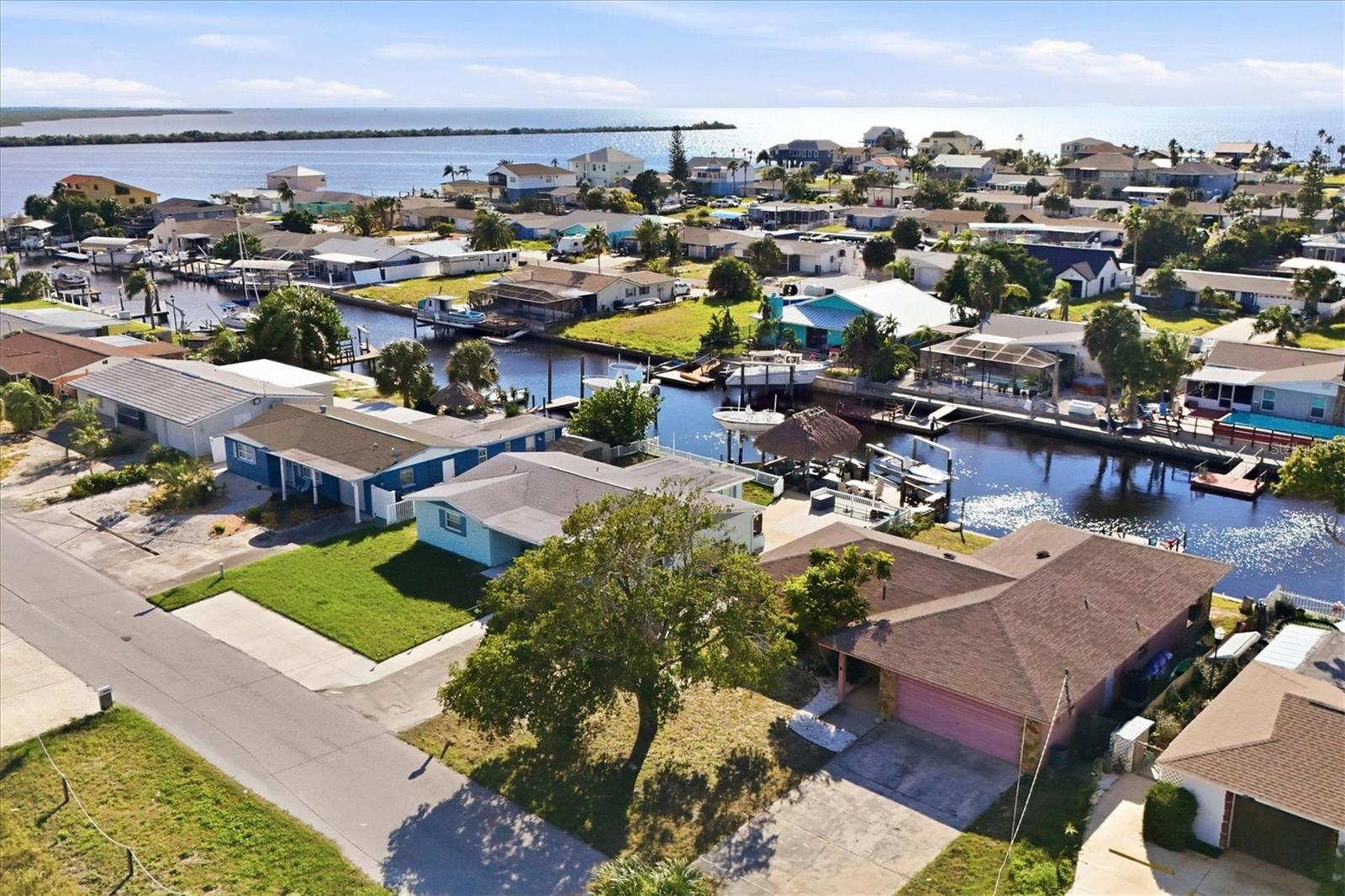 YOUR TURNKEY FURNISHED WATERFRONT ESCAPE AWAITS — WITH GULF ACCESS! Discover the Florida coastal lifestyle in this inviting 2-bedroom, 2-bath canal-front retreat located in Sea Ranch on the Gulf! Whether you're dreaming of a waterfront getaway, a full-time Florida residence, or a potential vacation rental investment, this home offers the flexibility to make it your own. Best of all, it's being sold TURNKEY FURNISHED, so you can start enjoying paradise from day one! Step inside to discover a beautifully updated interior designed for comfort, relaxation, and effortless coastal living. The welcoming living spaces provide the perfect setting to gather with family and friends, while the screened lanai invites you to slow down, enjoy your morning coffee, and take in the tranquil waterfront surroundings. LOVE THE WATER? THIS IS WHERE THE FUN BEGINS! Your private dock opens the door to endless opportunities for boating, fishing, kayaking, paddleboarding, and exploring the beautiful Gulf waters. Spend your afternoons on the water, enjoy the coastal wildlife, or simply relax and embrace the laid-back Florida lifestyle right from your backyard. Currently operating as an Airbnb vacation rental, this property offers an exciting opportunity for those seeking a furnished coastal retreat with potential investment possibilities. With the furnishings included, much of the work of setting up your Florida escape has already been done! Conveniently located near waterfront dining, shopping, marinas, and recreational activities, this home puts the best of Florida's Gulf Coast within reach. PACK YOUR BAGS, BRING YOUR BOAT, AND START LIVING THE WATERFRONT DREAM!