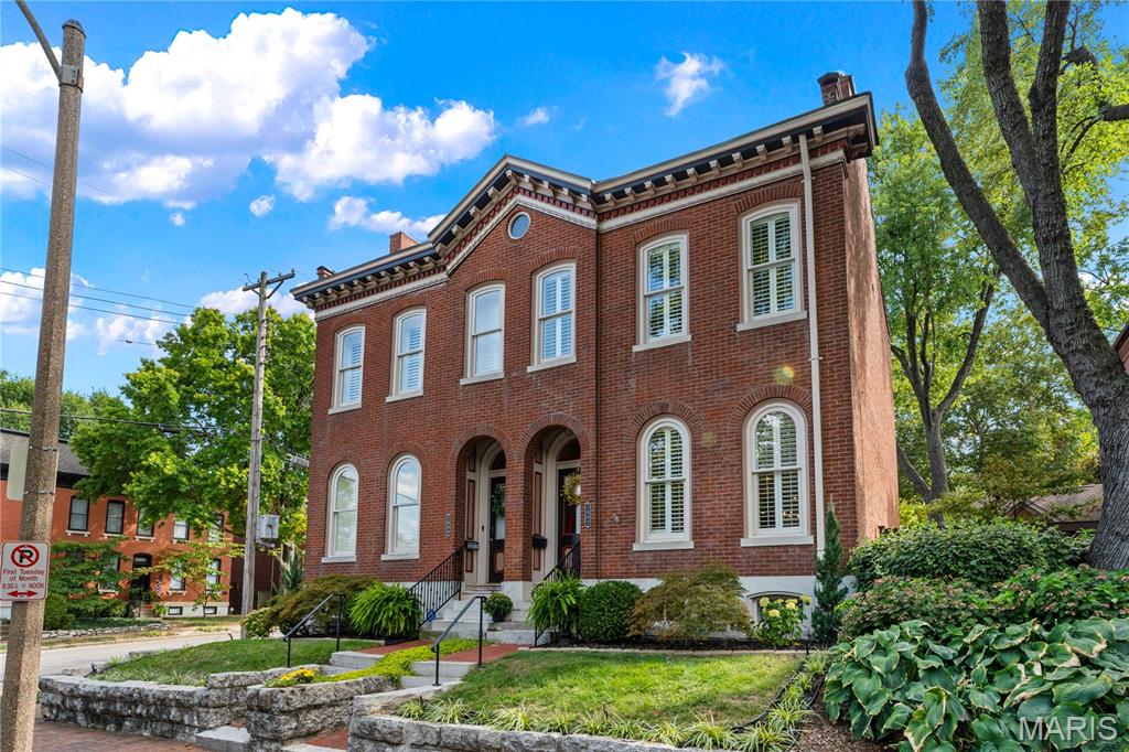 Welcome to this beautifully preserved and thoughtfully updated historic home in the heart of Lafayette Square. Built in 1874 and completely gutted and renovated in 2008, the residence features all new plumbing, electrical, HVAC, and modern infrastructure, blending timeless architectural charm with today’s comforts. The main level offers a great flow, featuring a living room with pocket doors that lead to the dining room and a stylish kitchen with a center island and access to the private paver patio. A powder room completes this level. The garage, with a second patio door, doubles as an inviting entertaining space. Upstairs are three bedrooms: two share a hall bath, while the spacious primary suite enjoys abundant natural light and a brand-new en-suite bath with oversized shower and dual heads. A third-floor loft provides flexible space for a home office. The lower level features a partially finished area that is ideal for a media room, gym, or playroom, along with generous unfinished storage space. Tucked away on a private street with no through traffic, the home offers peace and privacy while also delivering unmatched walkability to Lafayette Park and the neighborhood’s many restaurants, wine bar, coffee shop, ice cream shop, dry cleaner, and more.