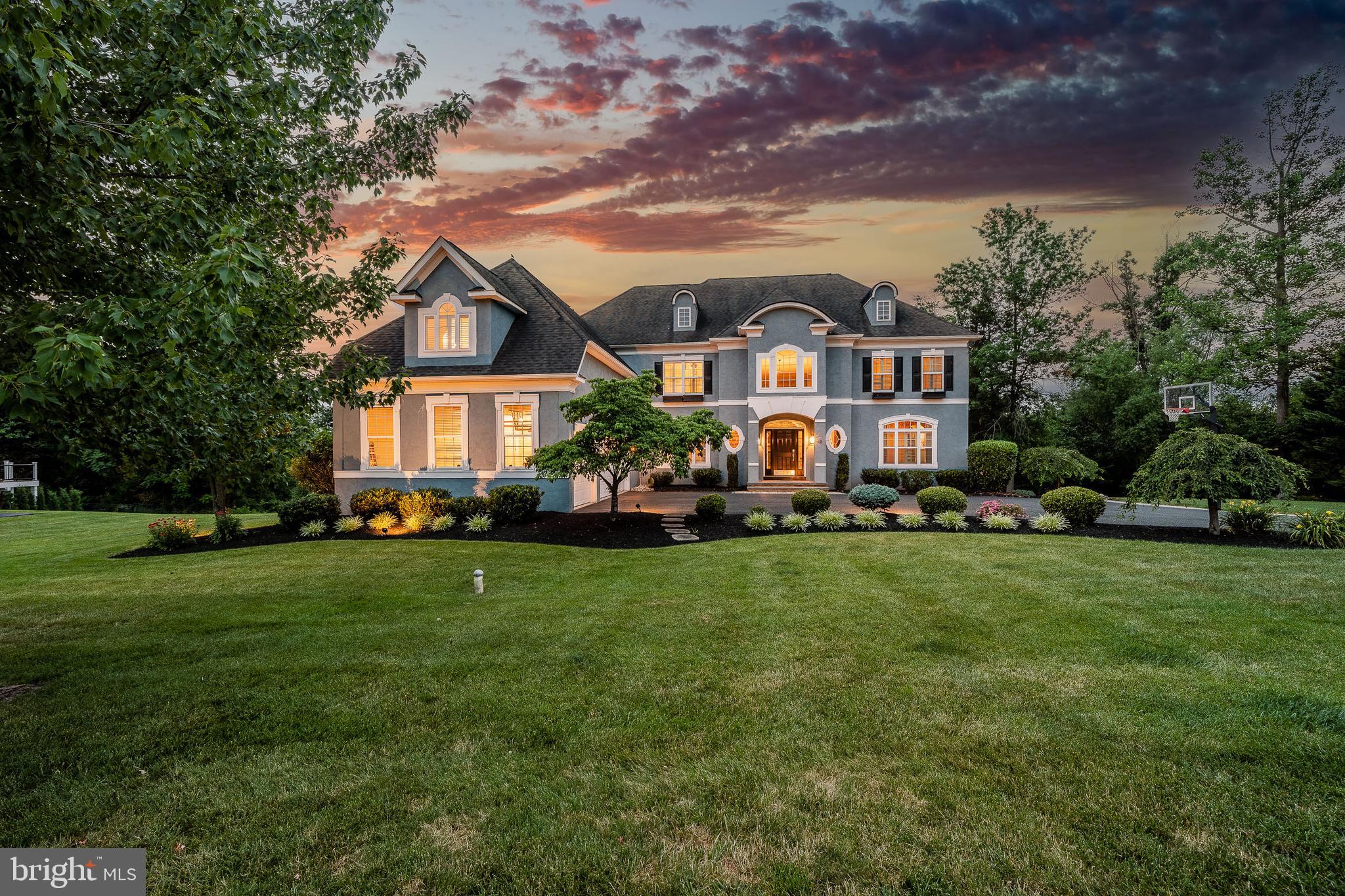Luxury Home for Sale in Pottstown, PA | Spectacular Golf Course Estate at 18 Putter Lane|Montgomery County Experience Luxury Living in the Prestigious Ravens Claw Golf Club CommunitySome homes simply check the boxes. Others leave a lasting impression the moment you arrive. Welcome to 18 Putter Lane, an extraordinary estate gracefully positioned on a private 0.89-acre homesite overlooking the rolling fairways of the prestigious Ravens Claw Golf Club community. NO HOA FEES Offering over 5,149 square feet of impeccably designed living space, this remarkable Colonial blends timeless architecture, refined finishes, and resort-inspired indoor-outdoor living to create a home that is every bit as impressive as its setting. A stately exterior and beautifully manicured grounds welcome you inside, where a dramatic two-story foyer showcases an elegant butterfly staircase, soaring ceilings, and rich architectural details that immediately set the tone. At the heart of the home, the breathtaking two-story family room is anchored by a stone fireplace and an incredible wall of windows that floods the space with natural light while capturing spectacular panoramic golf course views. Designed for both grand entertaining and comfortable everyday living, the gourmet kitchen offers granite countertops, abundant cabinetry, an oversized center island, double wall ovens, gas cooktop, updated tile flooring, and a new refrigerator. The adjoining breakfast area enjoys peaceful backyard views, while the formal living and dining rooms provide elegant spaces for hosting holidays, celebrations, and unforgettable gatherings. A private office with French doors offers an ideal work-from-home retreat. One of the home's most sought-after features is the private first-floor in-law suite with its own entrance, full kitchen, spacious living room, bedroom, and full bath, providing endless possibilities for multigenerational living, extended family, guests, or live-in caregivers while offering both comfort and independence. Upstairs, the owner's suite is a true sanctuary featuring a spacious sitting room, dressing area, an extraordinary four walk-in closets, and a spa-inspired bath with dual vanities, an oversized tiled shower, and a soaking tub designed for relaxation. Three additional generously sized bedrooms each feature their own private en-suite bath, providing exceptional comfort and privacy for family and guests. The full walk-out basement offers endless opportunities to create the space you've always imagined, whether it be a home theater, golf simulator, fitness studio, wine cellar, recreation room, or additional living area. The outdoor living experience truly sets this home apart. Completed in 2022, the spectacular custom-covered veranda transforms the backyard into a private four-season retreat featuring a built-in heating system and a stunning stone fireplace, creating an inviting outdoor living room that can be enjoyed long after summer has ended. Whether enjoying morning coffee overlooking the fairways, hosting elegant dinner parties beneath the covered veranda, watching football beside the fire on crisp autumn evenings, or gathering with family under the stars, this remarkable space was designed to bring people together. The expansive deck flows seamlessly from the home to the covered veranda and professionally designed patio below, creating multiple destinations for entertaining while maximizing the beauty, privacy, and serenity of the nearly one-acre golf course homesite. Additional highlights include five bedrooms, five full baths, one half bath, a three-car attached garage, natural gas heat, central air, public water and sewer, and an unbeatable location within one of Montgomery County's premier golf course communities. Combining elegant design, thoughtful functionality, breathtaking views, and an unparalleled lifestyle, 18 Putter Lane presents a rare opportunity to own one of the finest residences in Ravens Claw Golf Club.