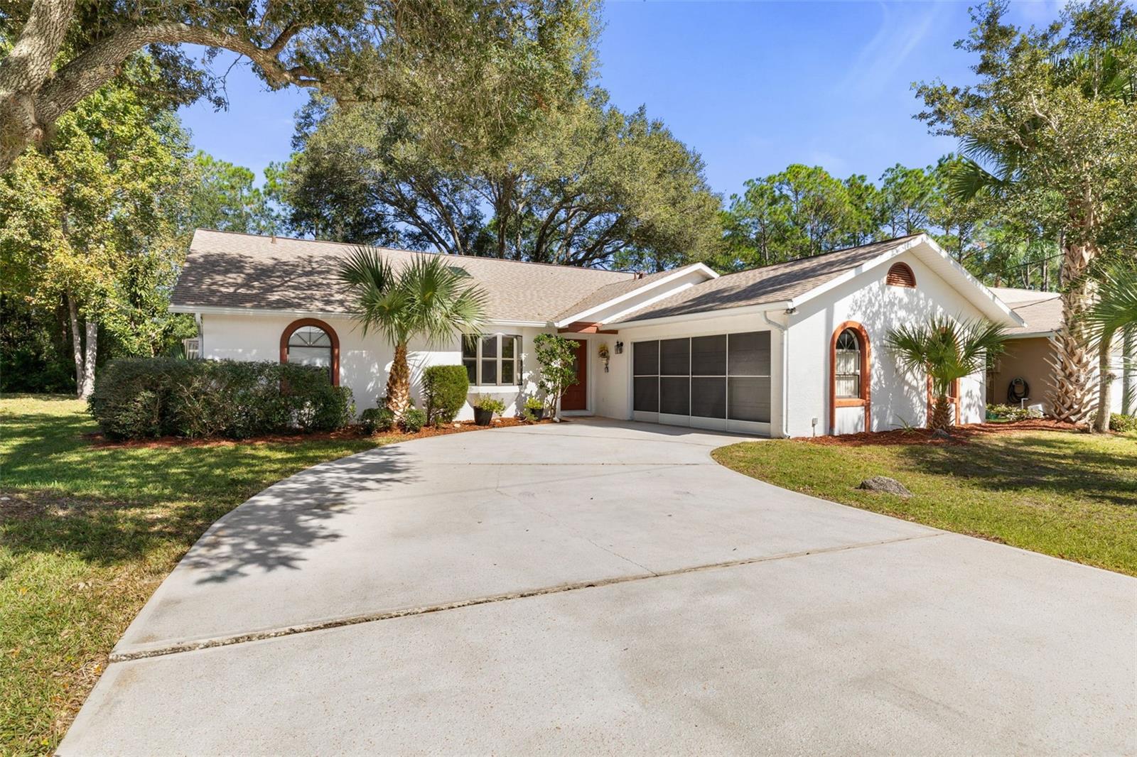 Virtually Staged. YOUR OWN PRIVATE FLORIDA RETREAT—WHERE NATURE, PRIVACY, AND POOLSIDE LIVING COME TOGETHER! Imagine starting your mornings with a cup of coffee surrounded by peaceful views of nature, spending sunny afternoons lounging by your private pool, and ending your evenings relaxing in your spa. Welcome to 11 Wilmont Place in Palm Coast, where the beauty of Florida's natural surroundings meets the comfort of your own backyard oasis! Backing up to a tranquil greenbelt, this inviting 3-bedroom, 2-bathroom pool home offers a peaceful natural backdrop and added privacy, creating the perfect setting for those who appreciate nature and outdoor living. Whether you're enjoying the scenery, unwinding poolside, or entertaining friends and family, this home makes everyday living feel like a getaway.Step inside to discover soaring vaulted ceilings, an inviting split-bedroom floor plan, and comfortable living spaces filled with possibilities. The primary suite features a versatile bonus room, ideal for a private home office, cozy reading retreat, hobby room, or peaceful sitting area overlooking your Florida lifestyle. The true highlight is your very own outdoor paradise! Take a refreshing dip in the sparkling swimming pool, soak up the Florida sunshine, or enjoy leisurely afternoons in the screened pool enclosure with the natural beauty of the greenbelt as your backdrop. The Florida room offers another relaxing escape, complete with an above-ground spa where you can unwind after a long day.Additional conveniences include a side-facing oversized two-car garage with attic storage and a garage screen door, offering flexibility and functionality. If you've been dreaming of a home where you can escape the hustle and bustle, enjoy nature right beyond your backyard, and embrace year-round poolside living, 11 Wilmont Place is ready to welcome you home!Discover your own slice of Florida paradise in beautiful Palm Coast!